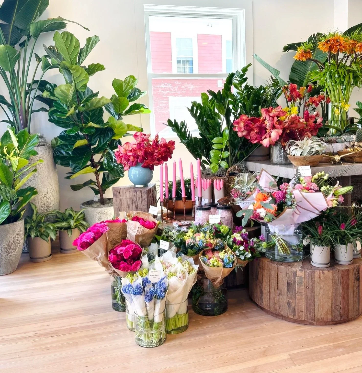 Fresh flowers, bouquets, plants and home decor are gathered in a retail shop in downtown Winchester Center, MA.
