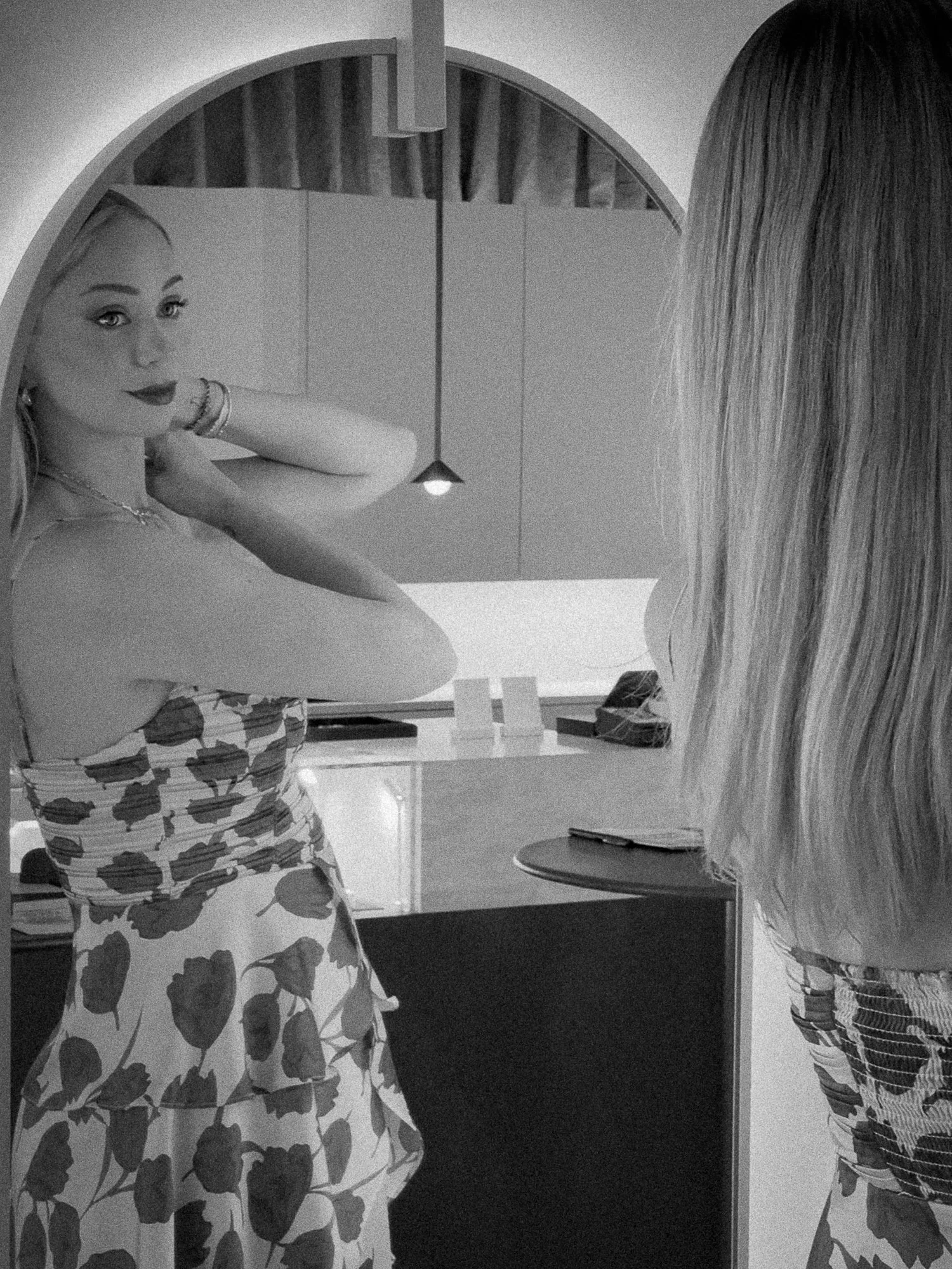 woman trying on necklace looking in mirror content creator melbourne