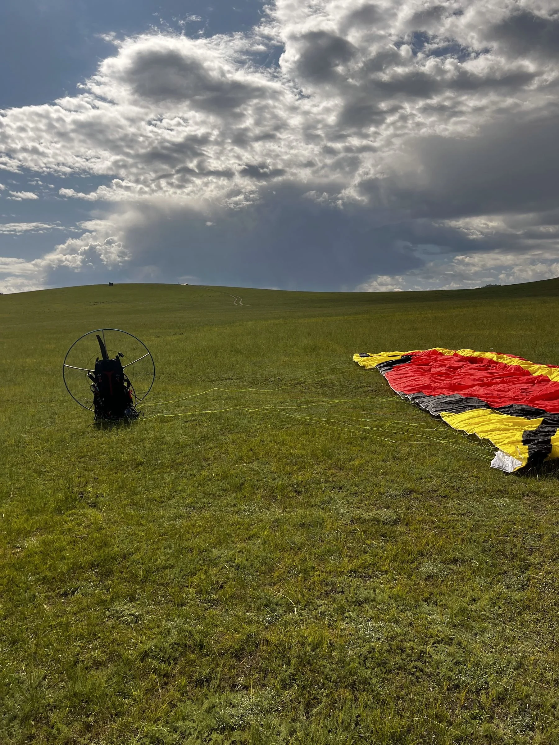 Steppe PPG paramotor and wing laid out on the Mongolian steppe