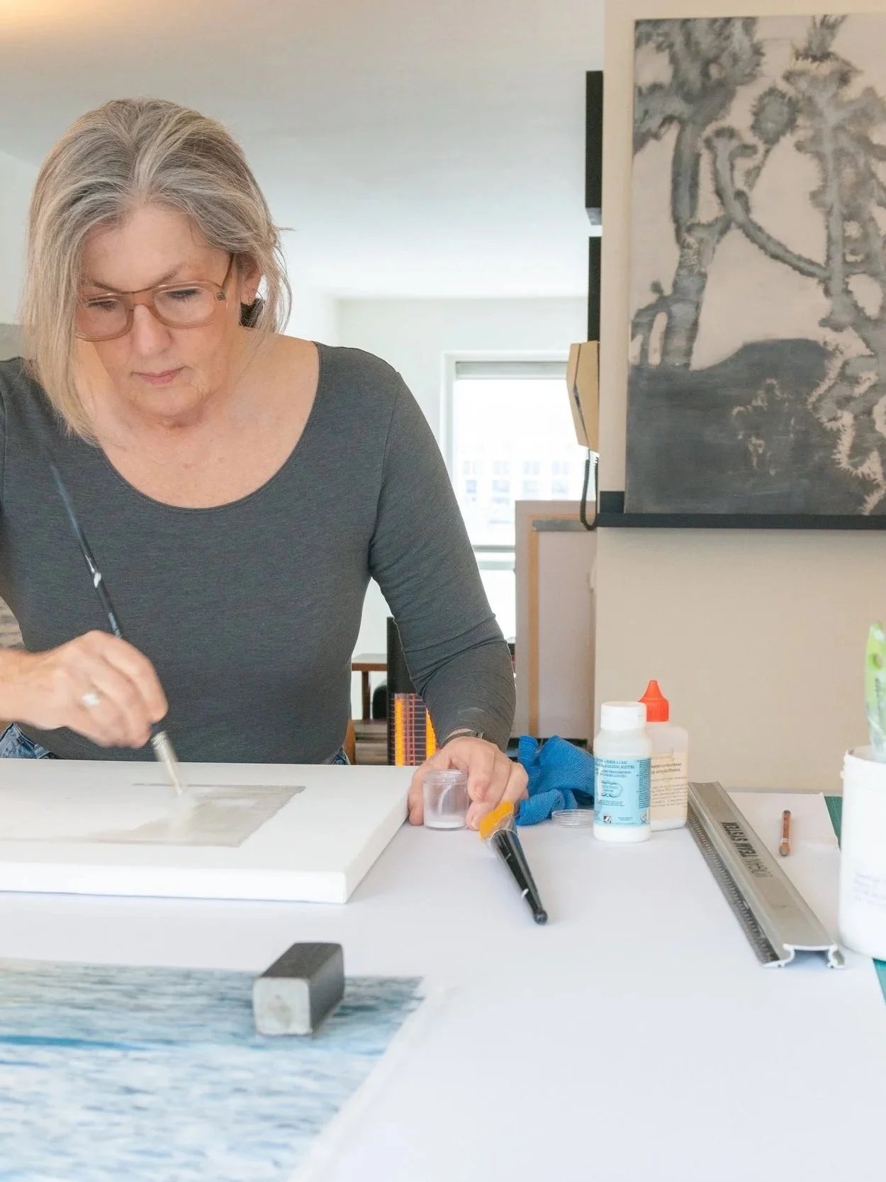 Dutch visual artist Margaret Lansink in her studio with mixed-media artworks.