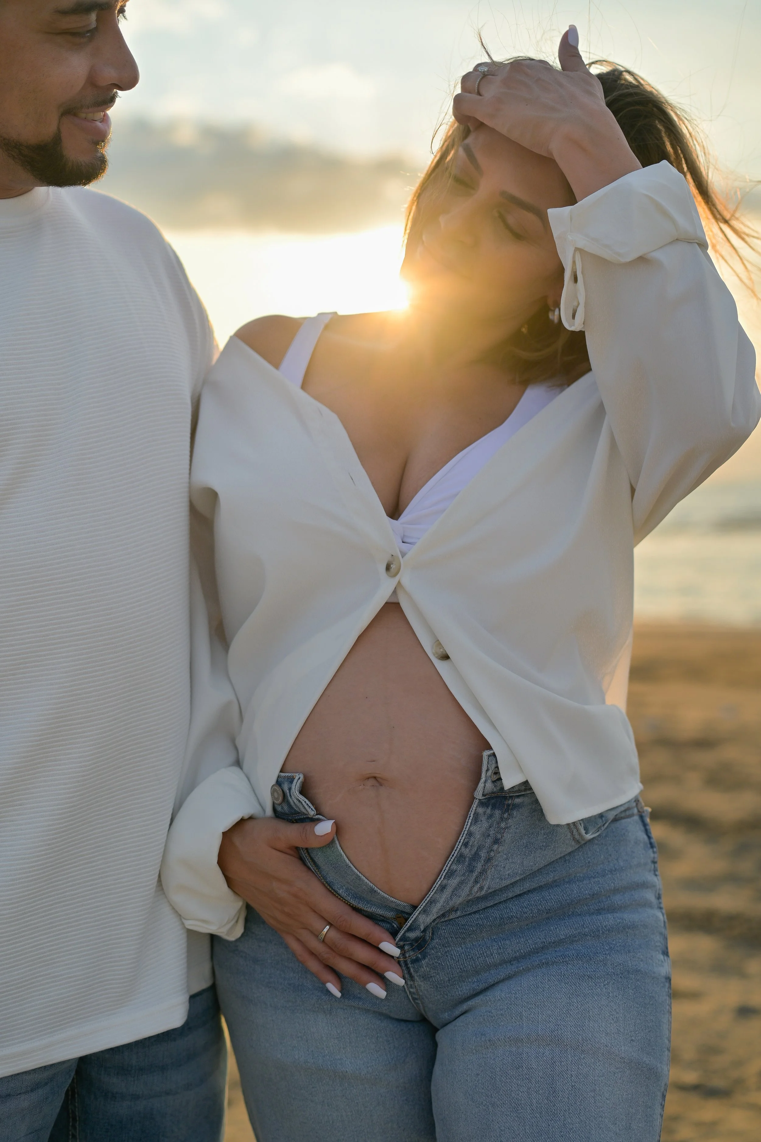 houston galveston beach maternity photos with sunflare and belly on display