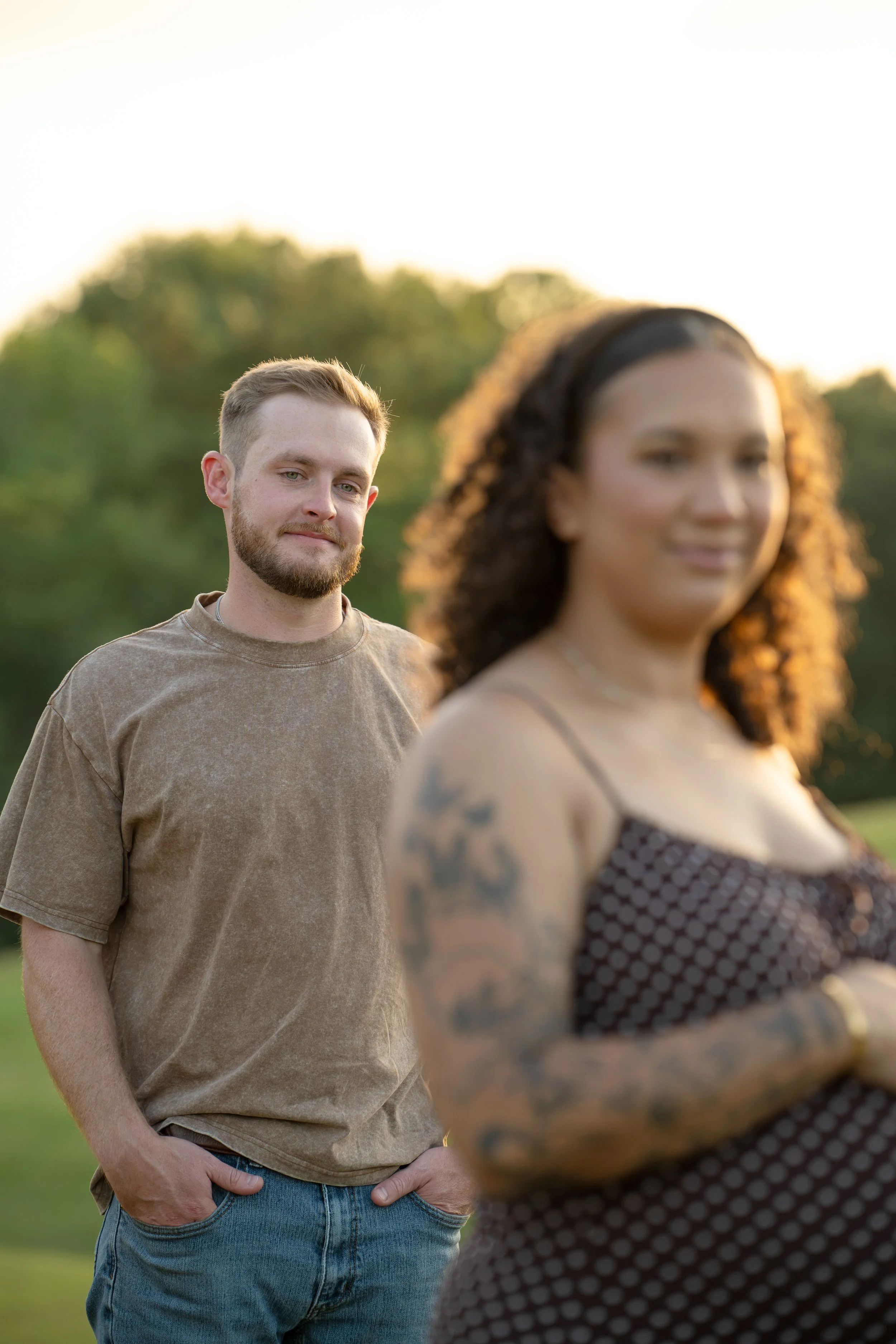 the woodlands husband admiring pregnant wife during maternity photos