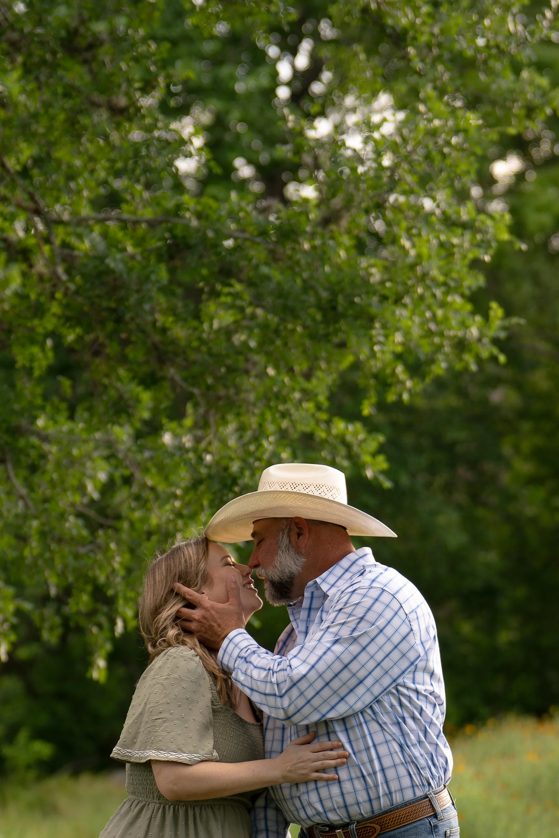 houston couple embracing in kiss in nature Terry Hershey park
