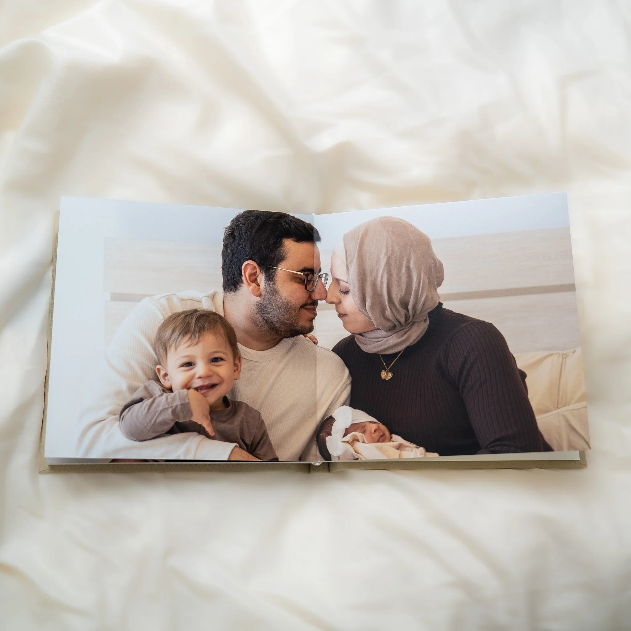 luxury photo album of houston in-home newborn photographer