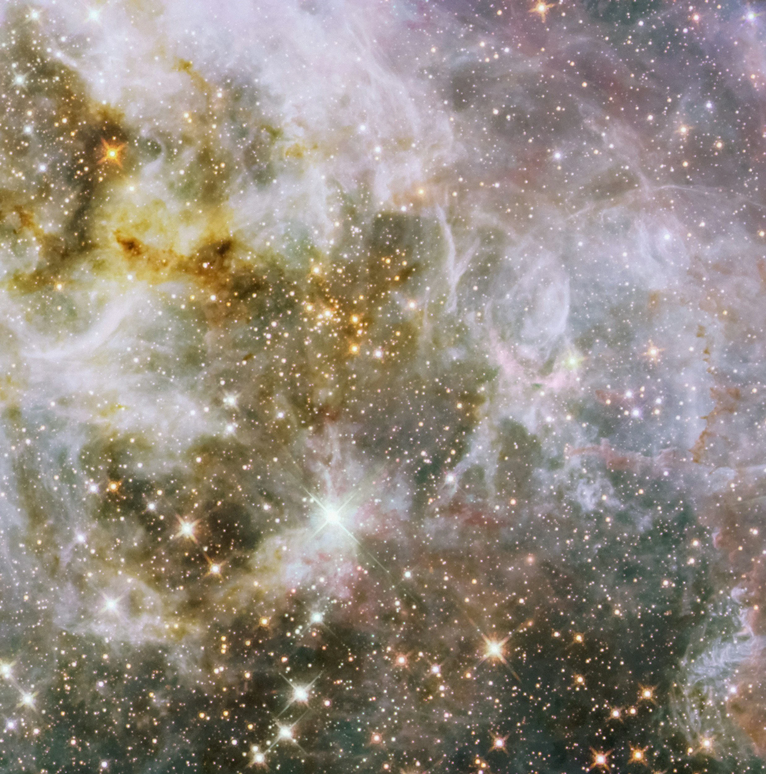 A detailed image of outer space showing stars, nebulae, and cosmic dust.