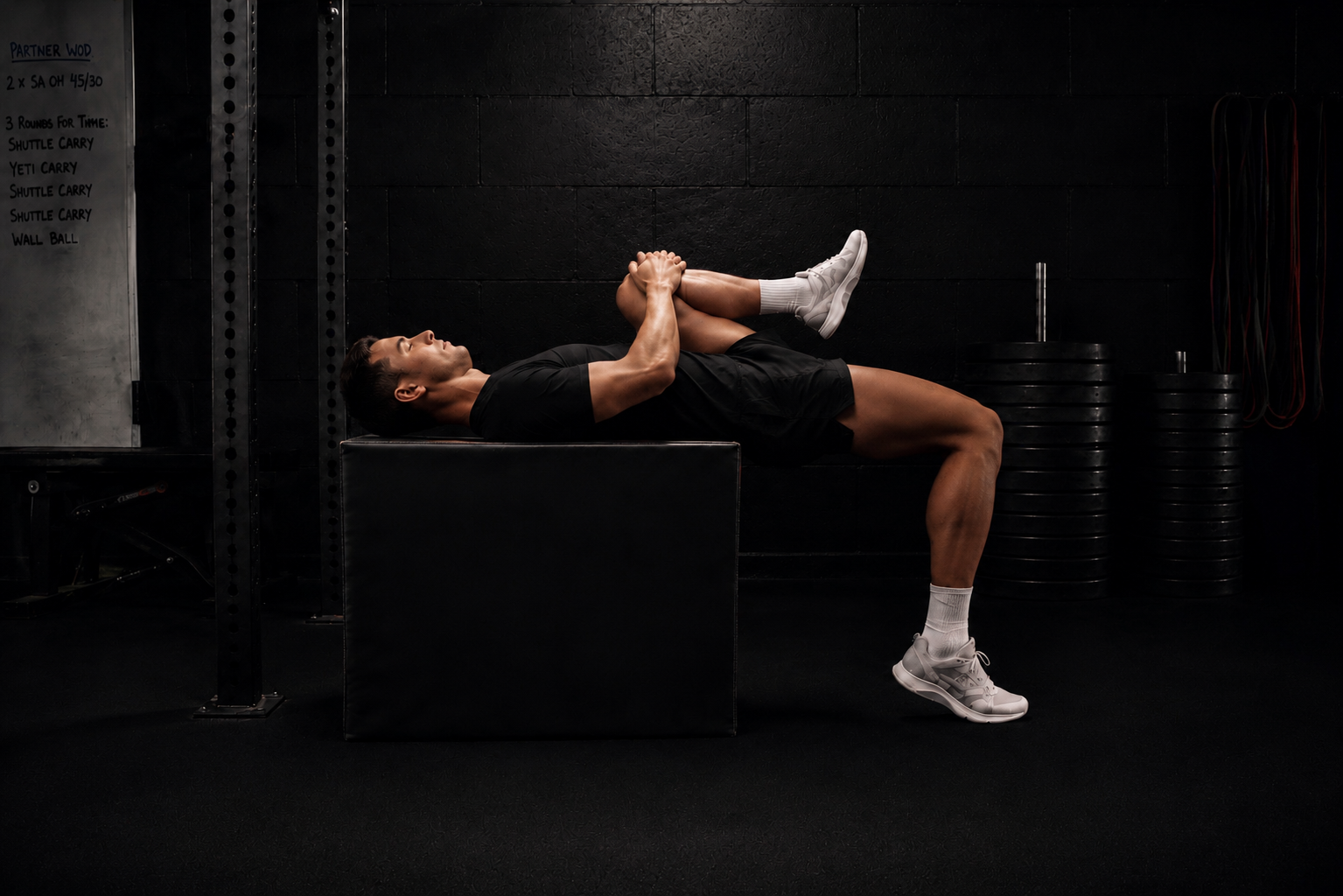 Performance coach conducting a modified Thomas test during corporate performance and movement assessment in London.