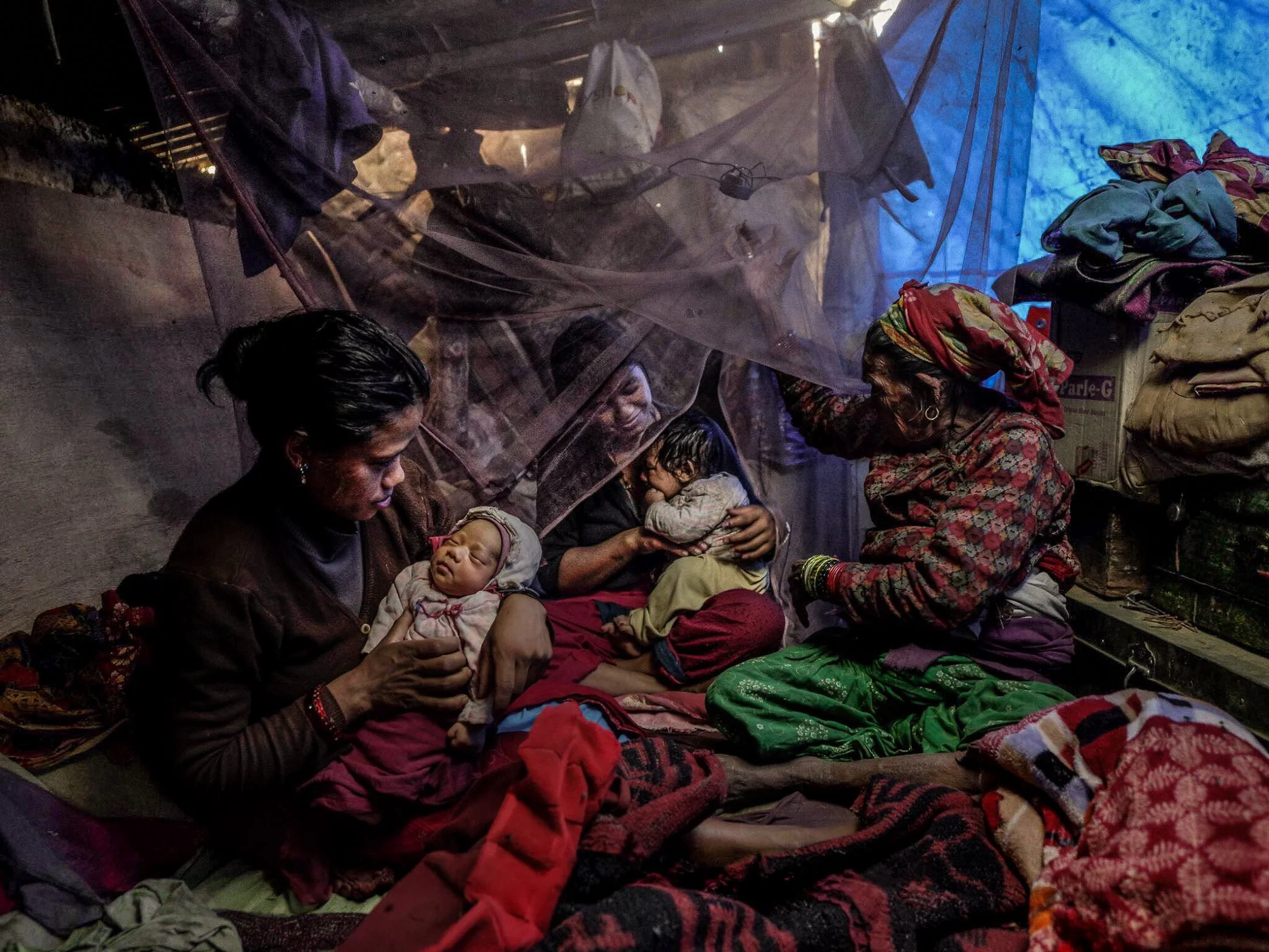 After the Nepal earthquake destroyed her family’s home and belongings, Shanta holds her newborn baby inside a crowded temporary shelter. What should have been a moment of celebration became a daily struggle for space, safety, and dignity, as she and 