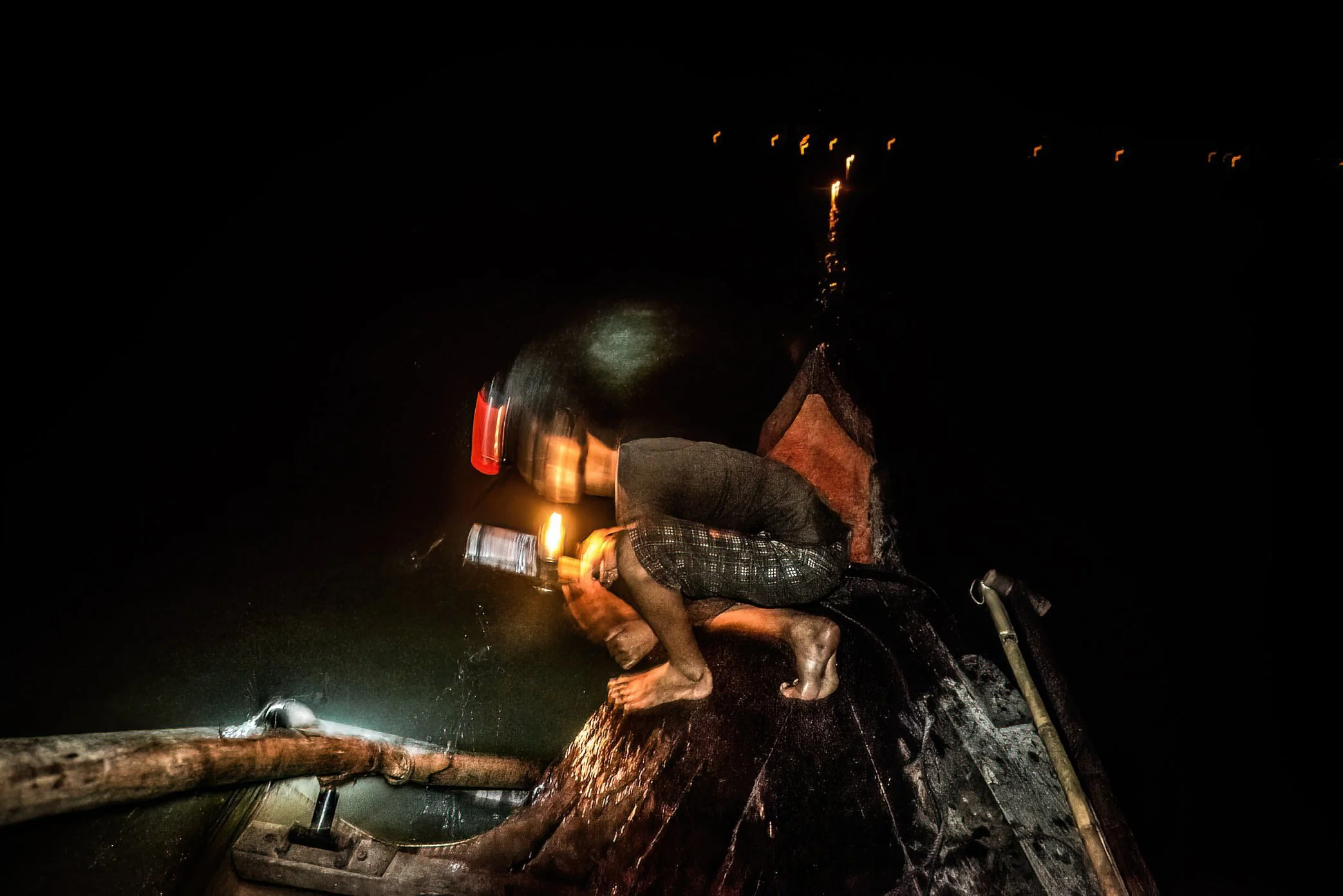 Tonle Sap, Cambodia - After dark, fishermen set out across the Tonle Sap carrying dozens - sometimes hundreds - of kerosene lamps. The flames draw insects toward the water; as they fall, fish gather beneath the light. Before dawn, or when experience 
