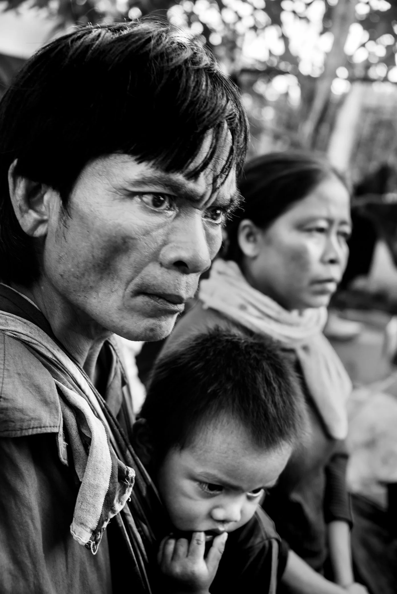 Sanamxai School Shelter, Attapeu, Laos - 
Survivors of the Xe Pian dam collapse sit in tense silence at the Sanamxai School shelter. Displaced from Hin Lat and nearby villages, families waited for news, aid, and any sign of what might come next. In t