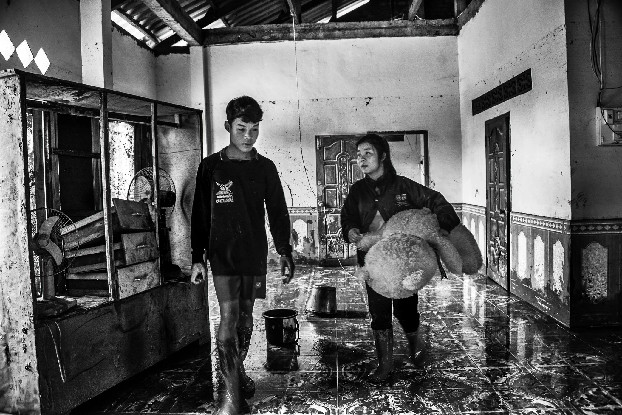 Khok Kong Village, Attapeu, Laos - Survivors of the Xe Pian dam collapse return to clean what remains of their home in Khok Kong, one of seven villages affected by the disaster. In parts of the village, floodwater rose nearly three meters high, leavi