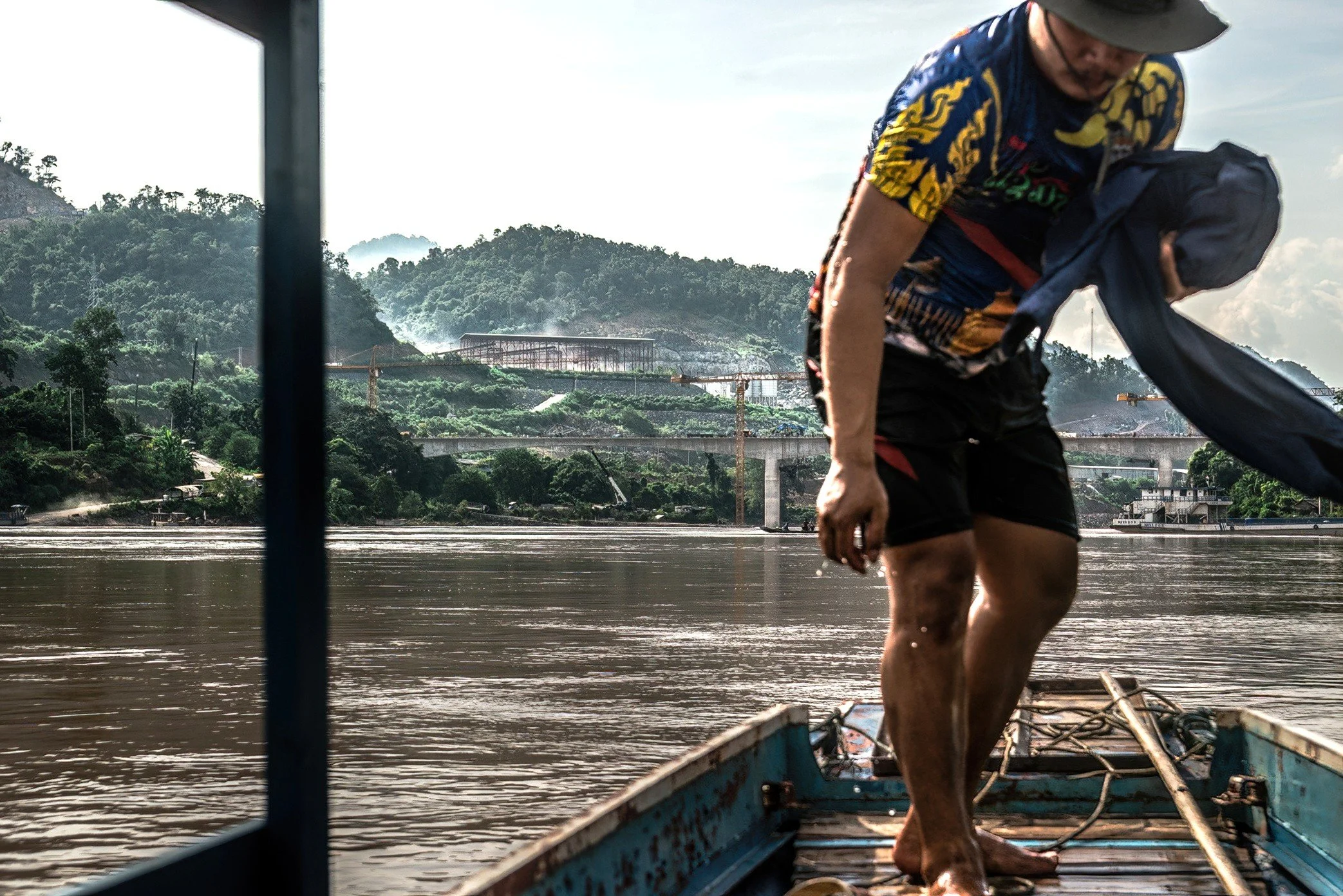 From a local tour boat on the Mekong, the changing landscape near the mouth of the Nam Ou comes into view. For villagers, boatmen, fishermen, and small tourism businesses, this stretch of river has long been part of daily life and local income. Now, 