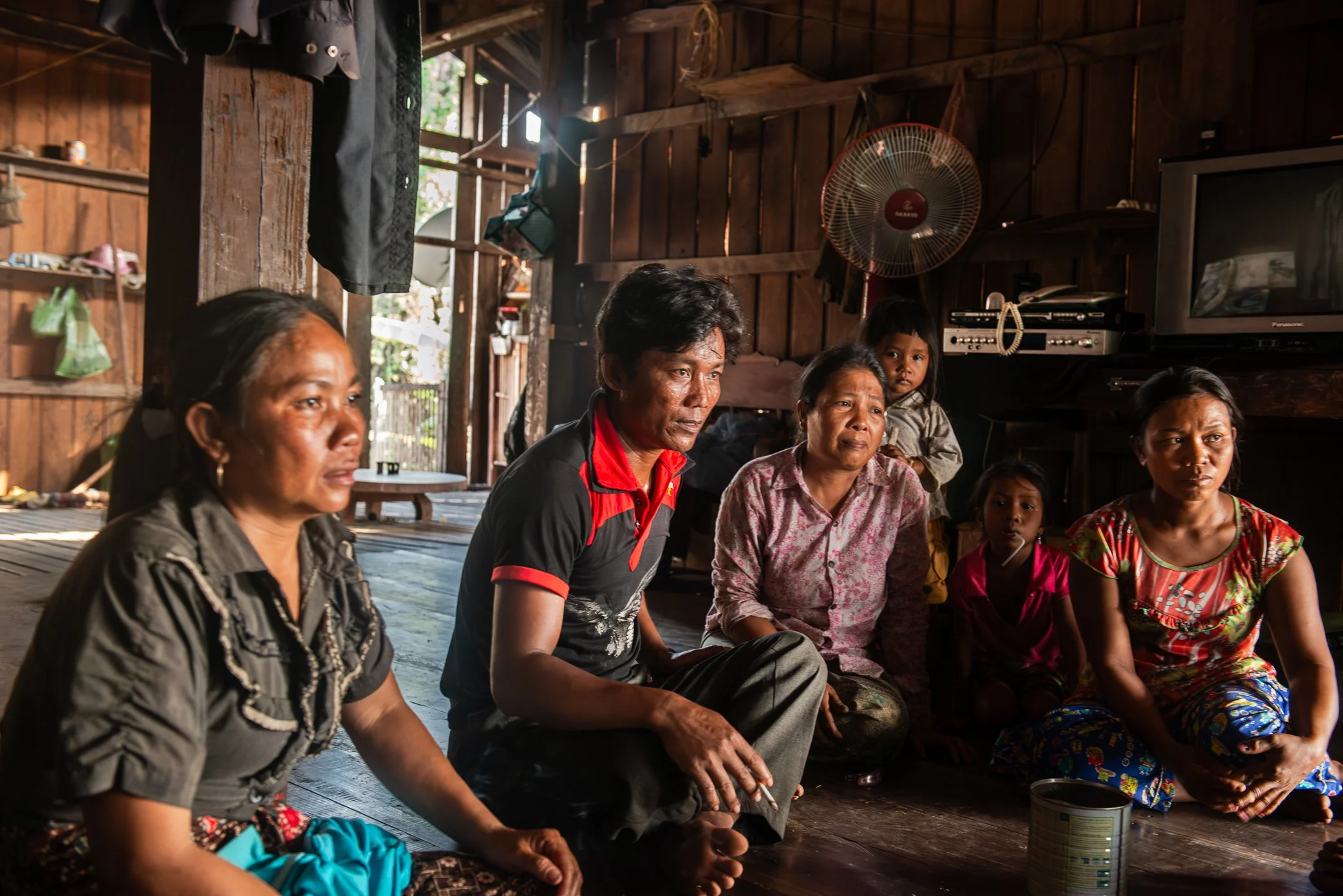 Srekor village, Stung Treng Province, Cambodia.
Villagers meet inside a wooden home to discuss compensation and resettlement as the Lower Sesan 2 Dam moves forward. For families in Srekor, the question was not only how much money or land they would r