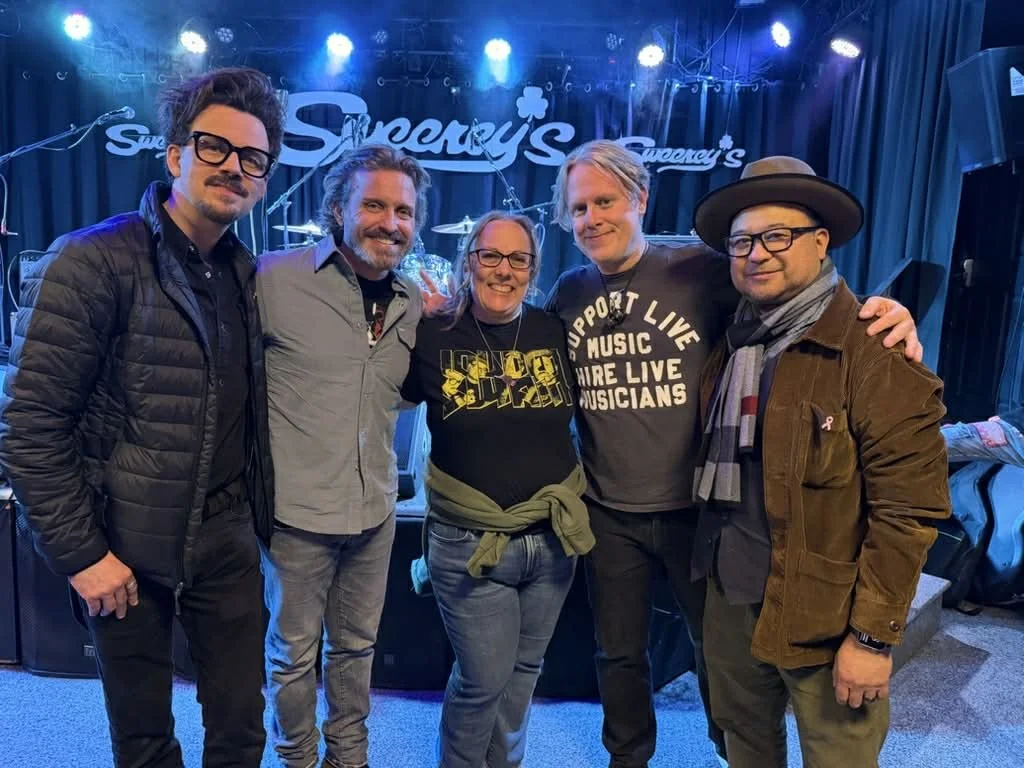 Jenn Currie deFouw with friends and music community, inspiration behind her storytelling and romance novels