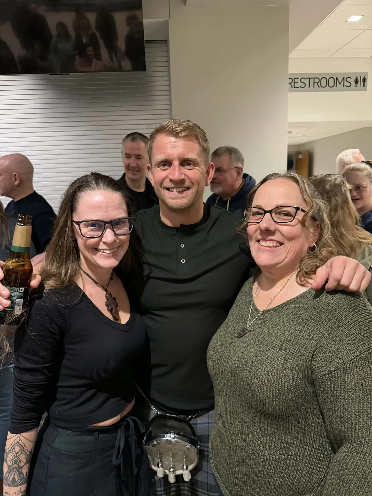 Jenn Currie deFouw with friends and music community, inspiration behind her storytelling and romance novels