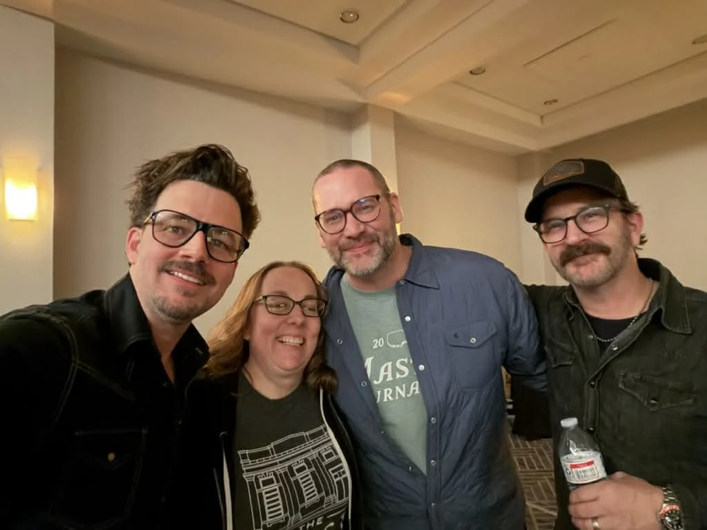 Jenn Currie deFouw with friends and music community, inspiration behind her storytelling and romance novels