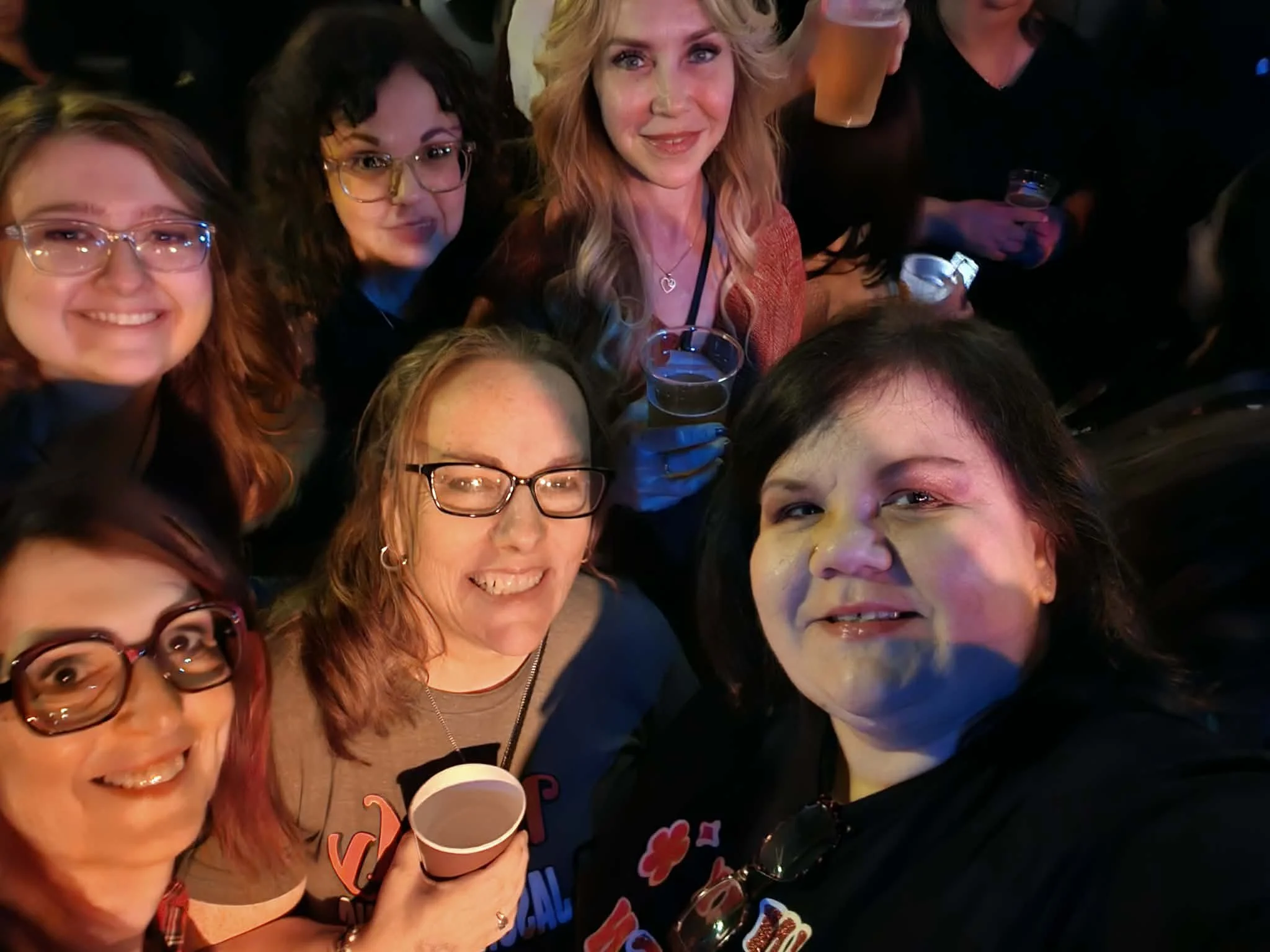 Jenn Currie deFouw with friends and music community, inspiration behind her storytelling and romance novels
