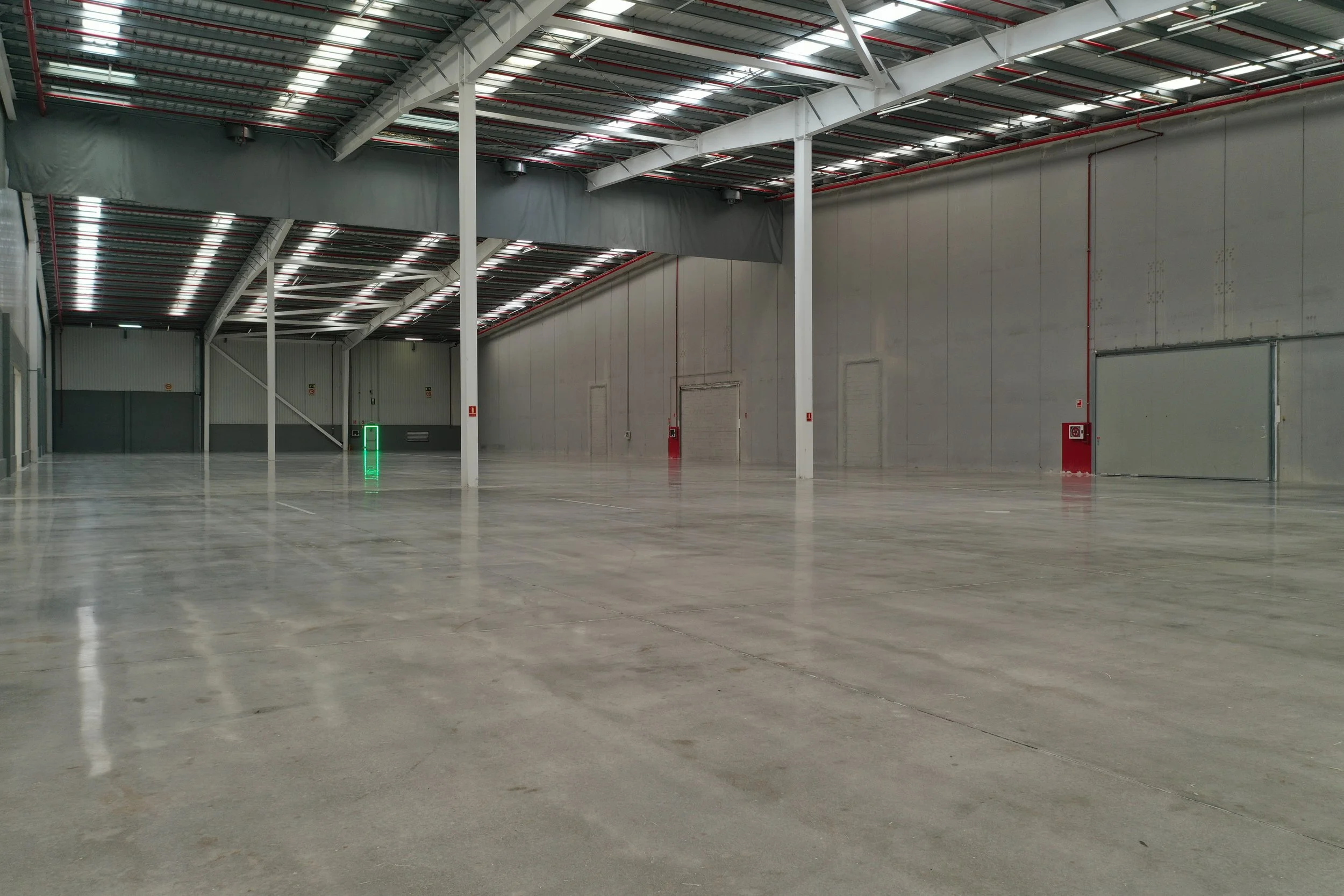 Polished concrete floor in industrial warehouse treated with the RINOL DRT system