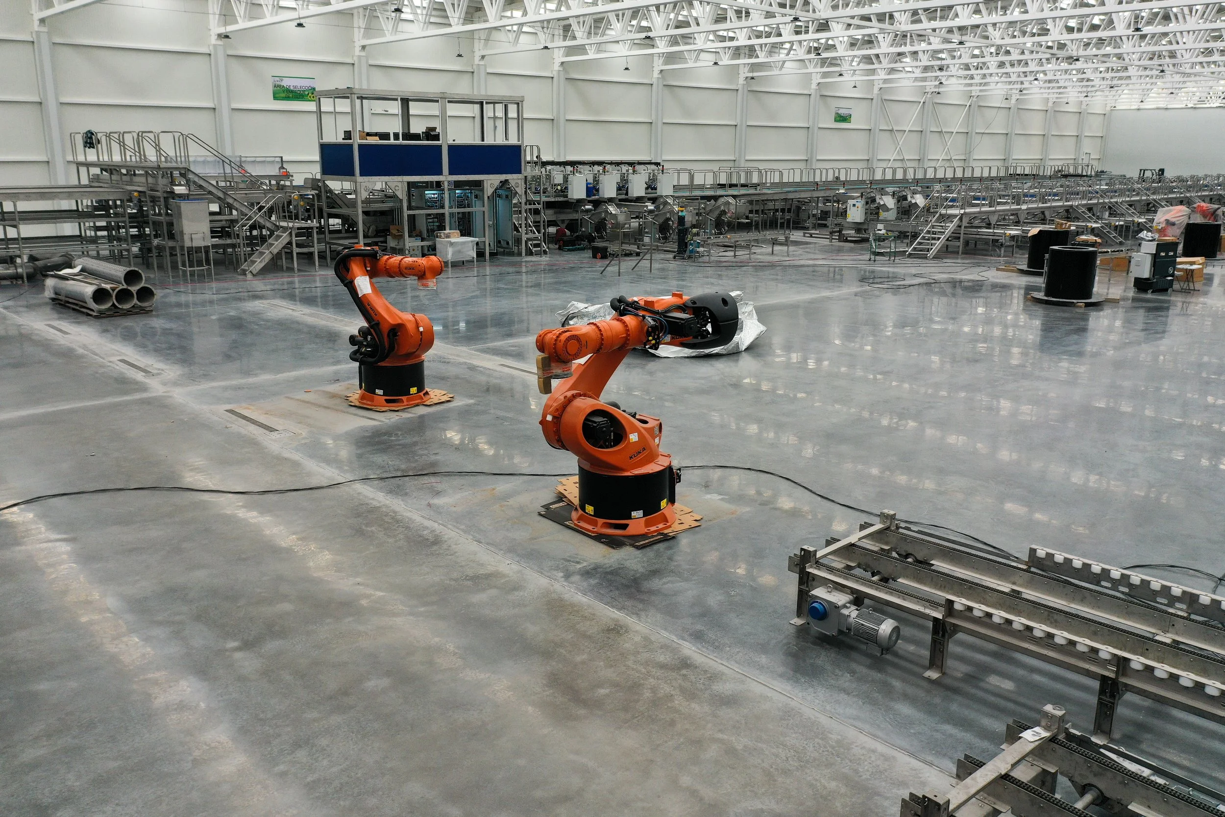 Polished concrete floor in industrial assembly facility treated with the RINOL DRT system.