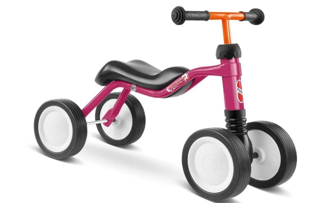 Berg Fux  Kinderrad mit rosa Rahmen, schwarzem Sitz und großen weißen Rädern