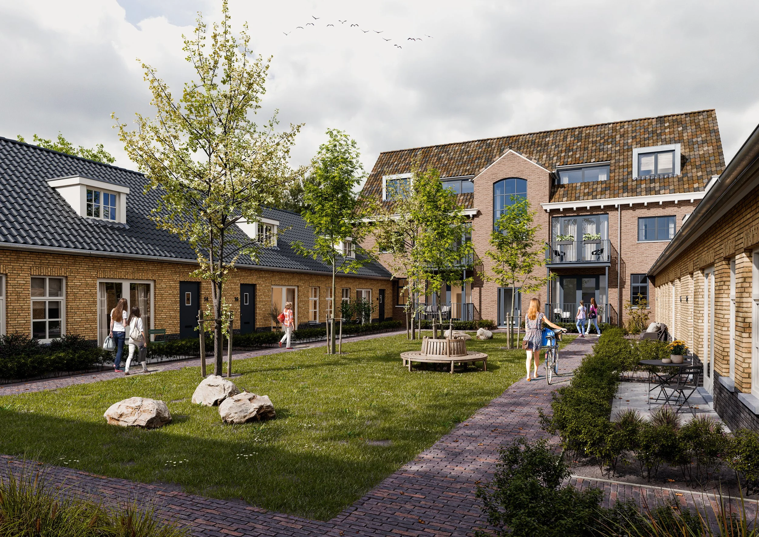 Een rustige binnenplaats met gras, bomen, bankjes en mensen die wandelend en fietsend genieten, omringd door moderne huizen.