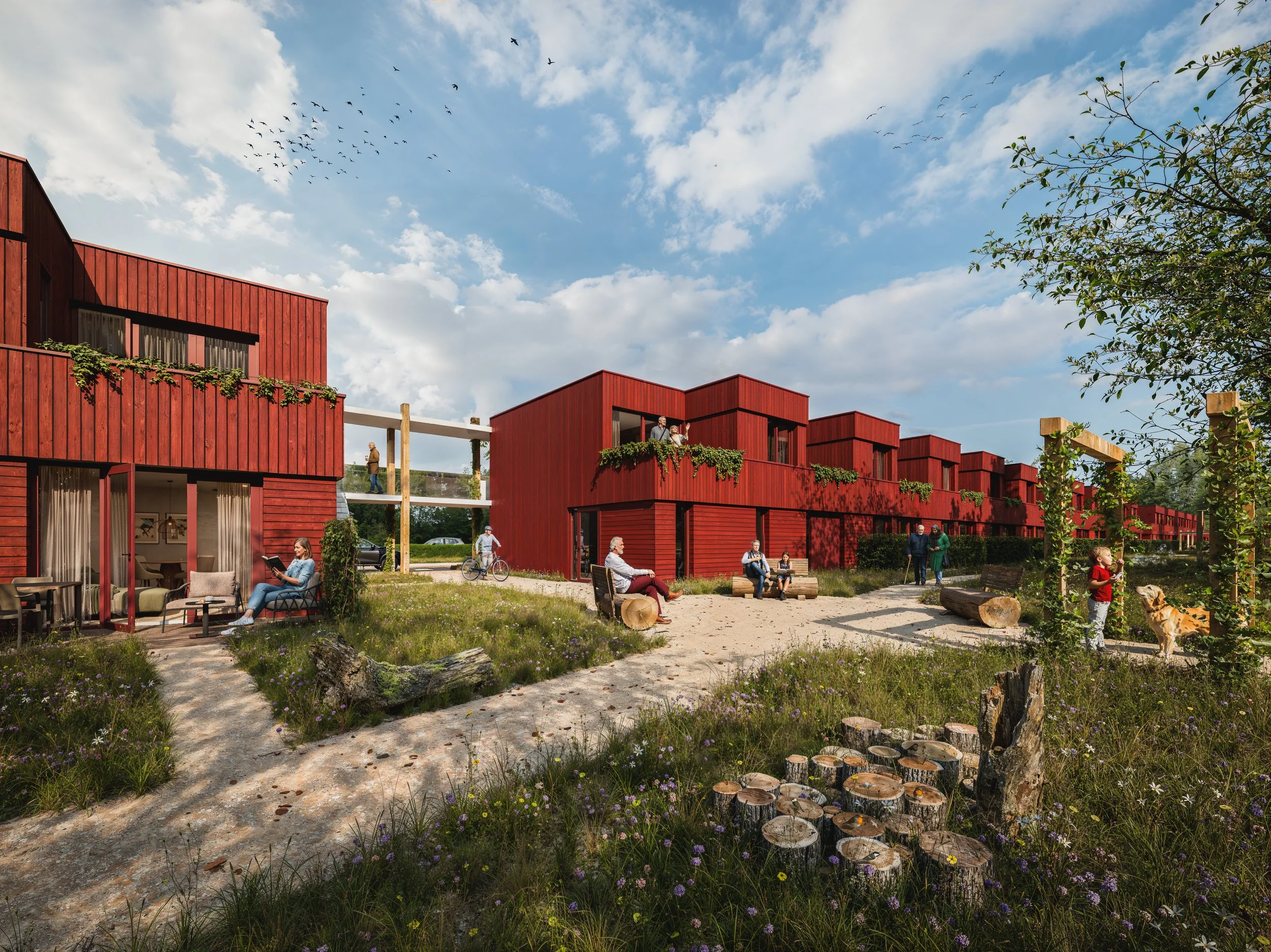 Moderne rode houten rowhouses met grote ramen en tuinen, mensen die buiten genieten en spelen, een open lucht terras met banken, bloemen en bomen onder een blauwe hemel met wolken en vogels.