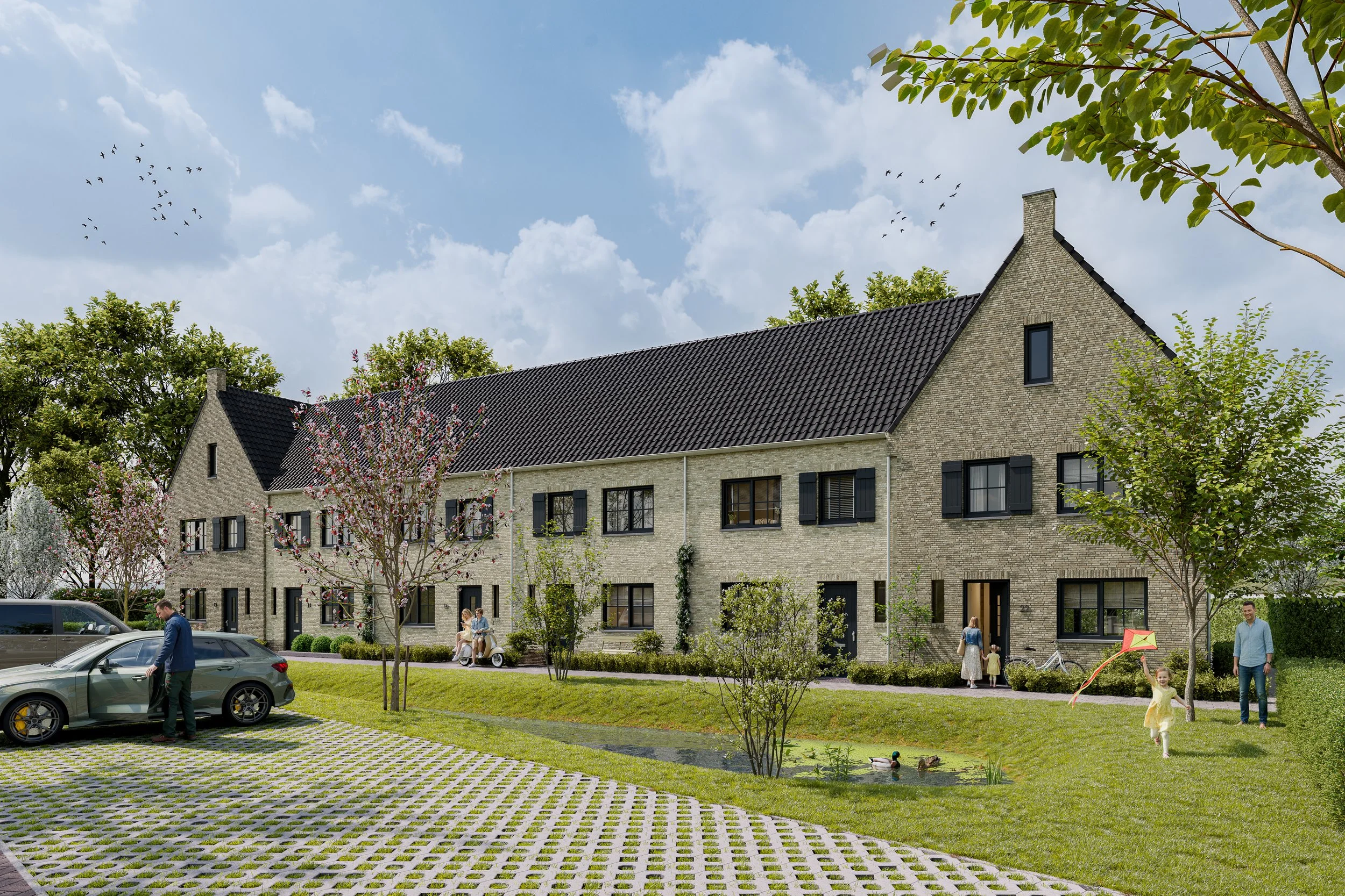 Een gemeenschappelijke groene tuin met een nieuw gebouwd rijtjeshuis met een zwarte pannendak. Er zijn mensen die in de tuin wandelen, fietsen, en op banken zitten, er zijn ook kinderen die kermis spelen met een vlieger. Een auto staat geparkeerd op 