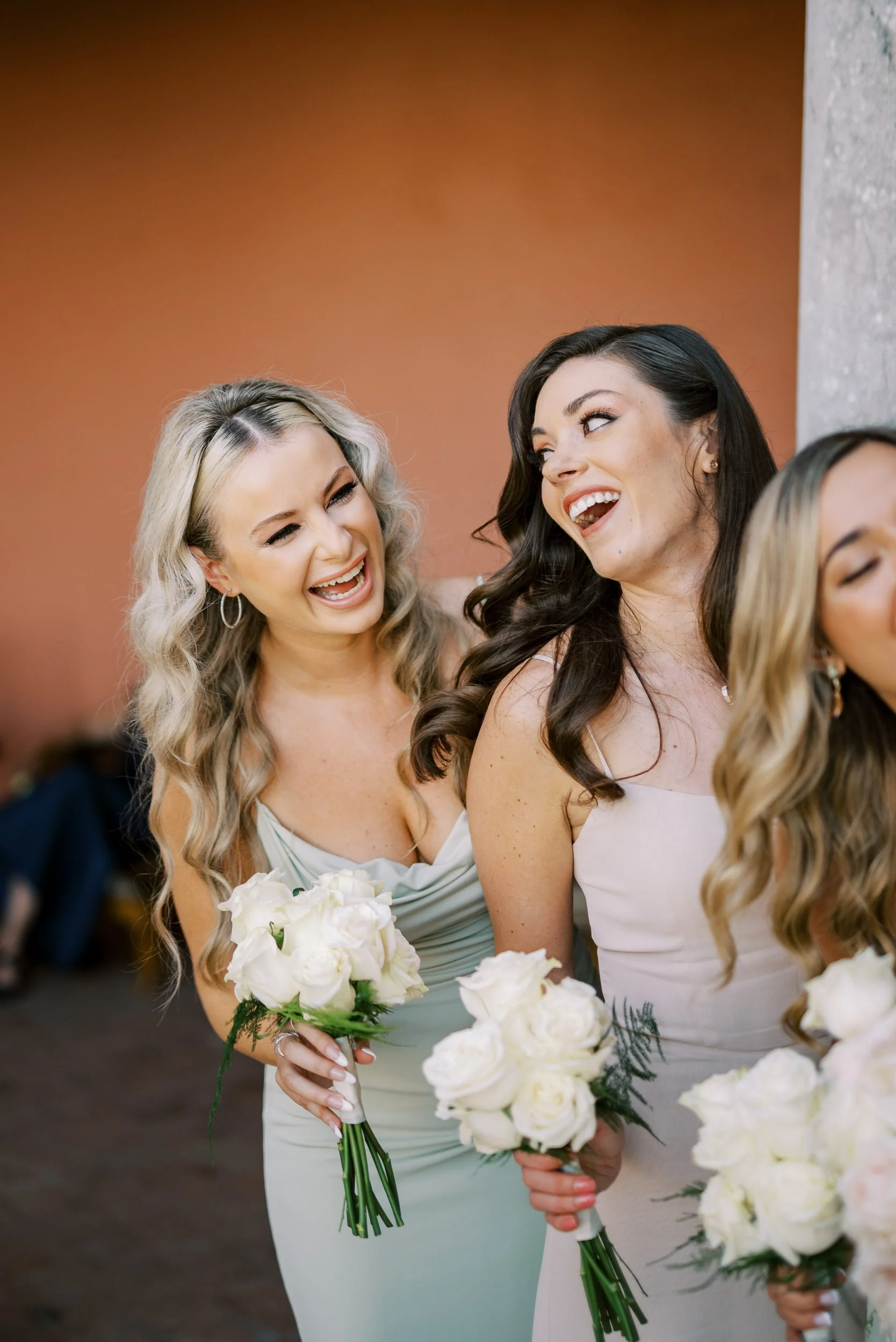 Bride laughing with bridesmaids at Casa dos Penedos in Sintra