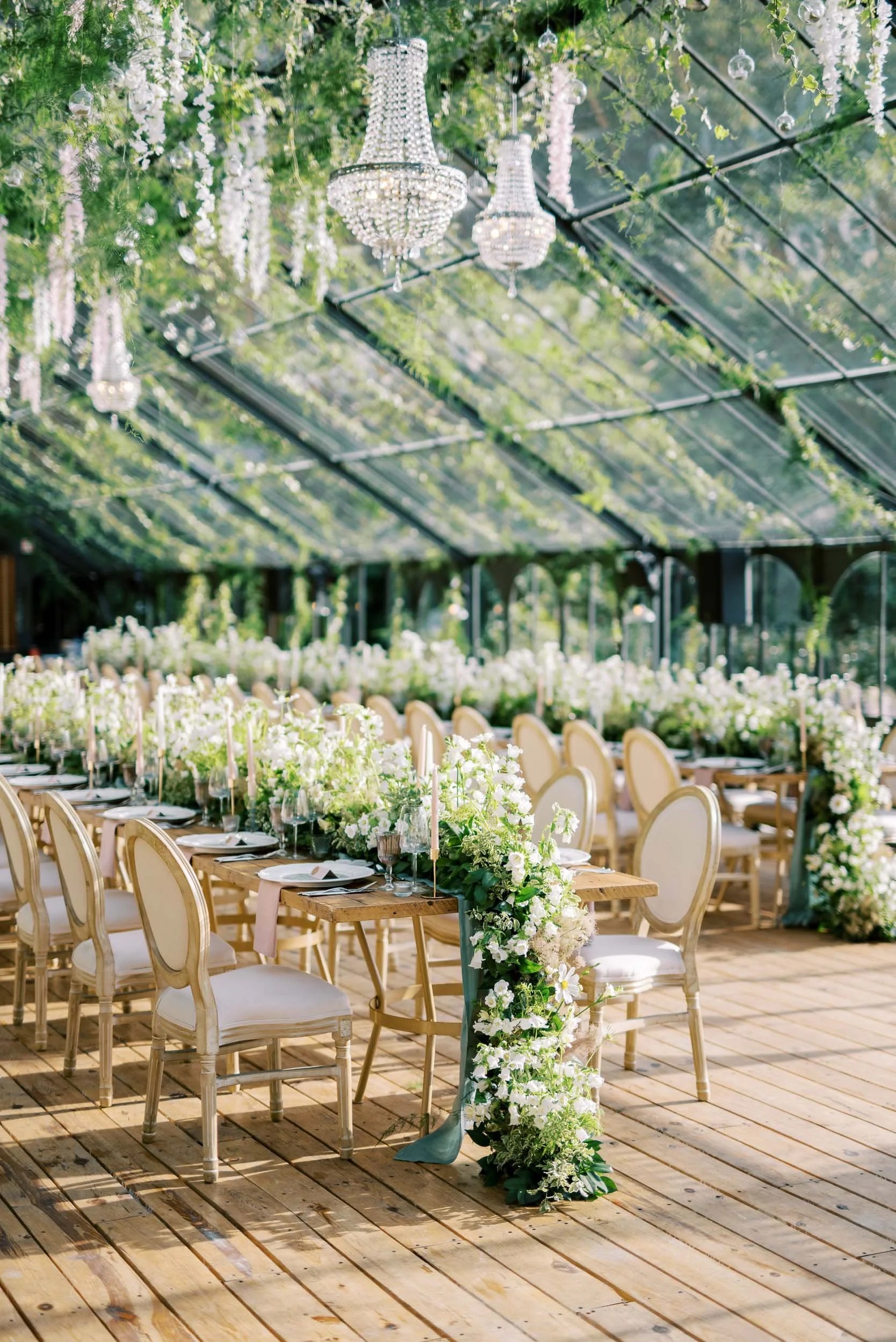 Wedding reception tables inside the Glass House at Quinta da Bella Vista in Sintra, Portugal