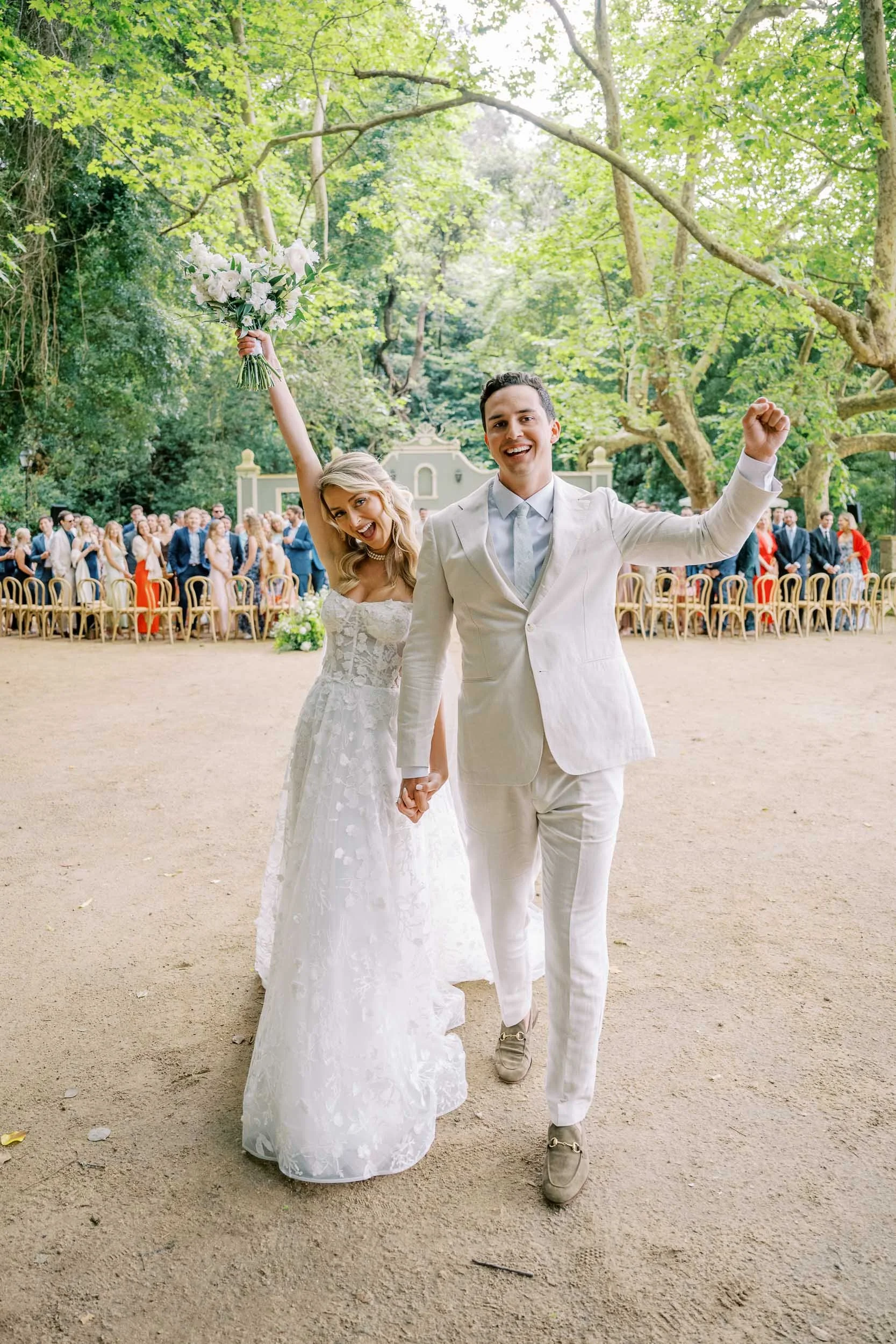 Bride and groom celebrating after the ceremony at Quinta da Bela Vista in Sintra, Portugal