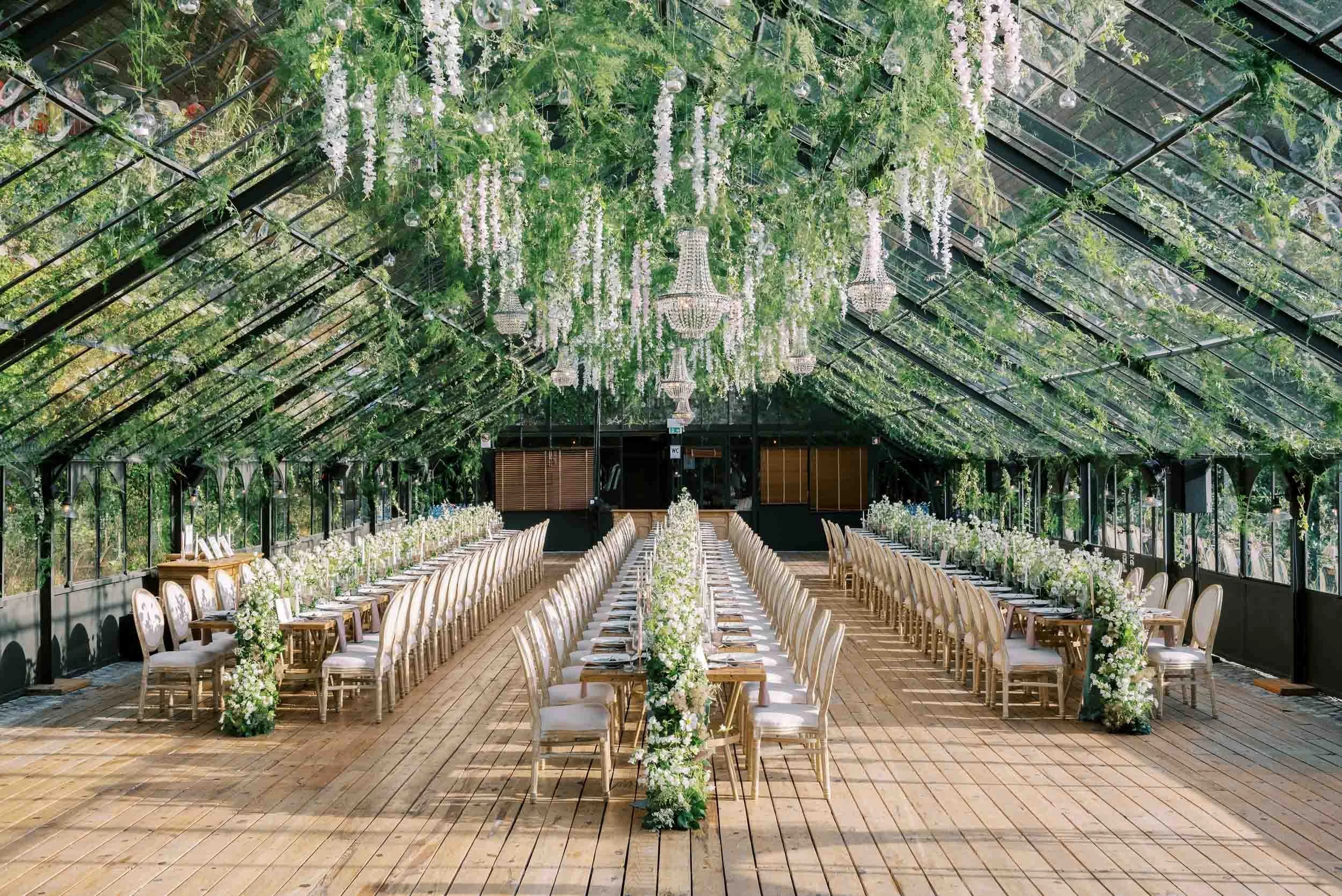 Reception dinner setup inside the Glass House at Quinta da Bella Vista in Sintra, Portugal