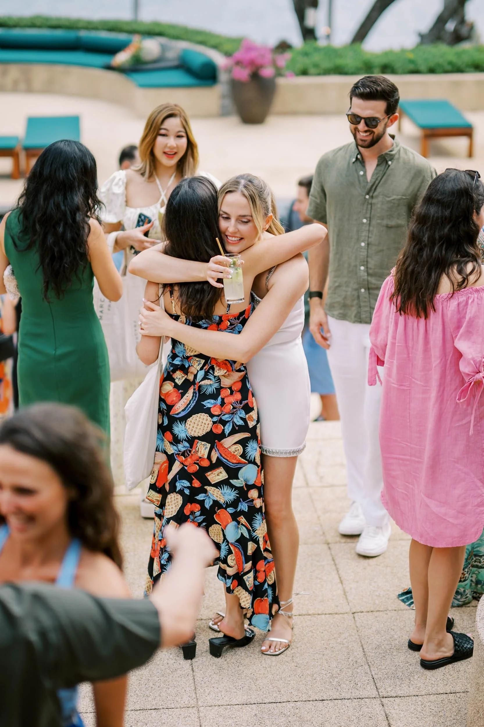 Guests embracing during the welcome celebration at Amanpuri in Phuket, Thailand