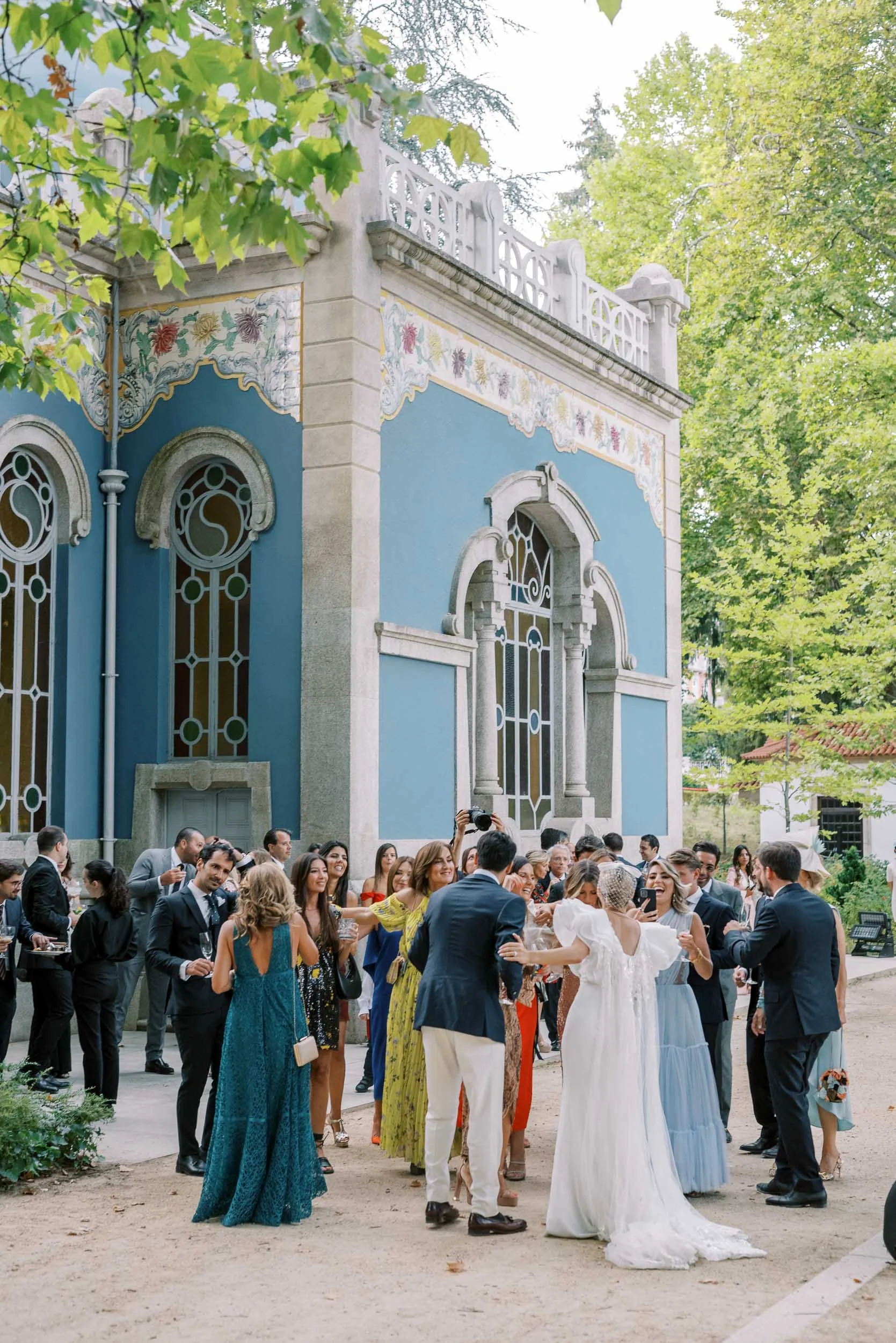 Wedding guests during cocktail hour at Vidago Palace in Portugal