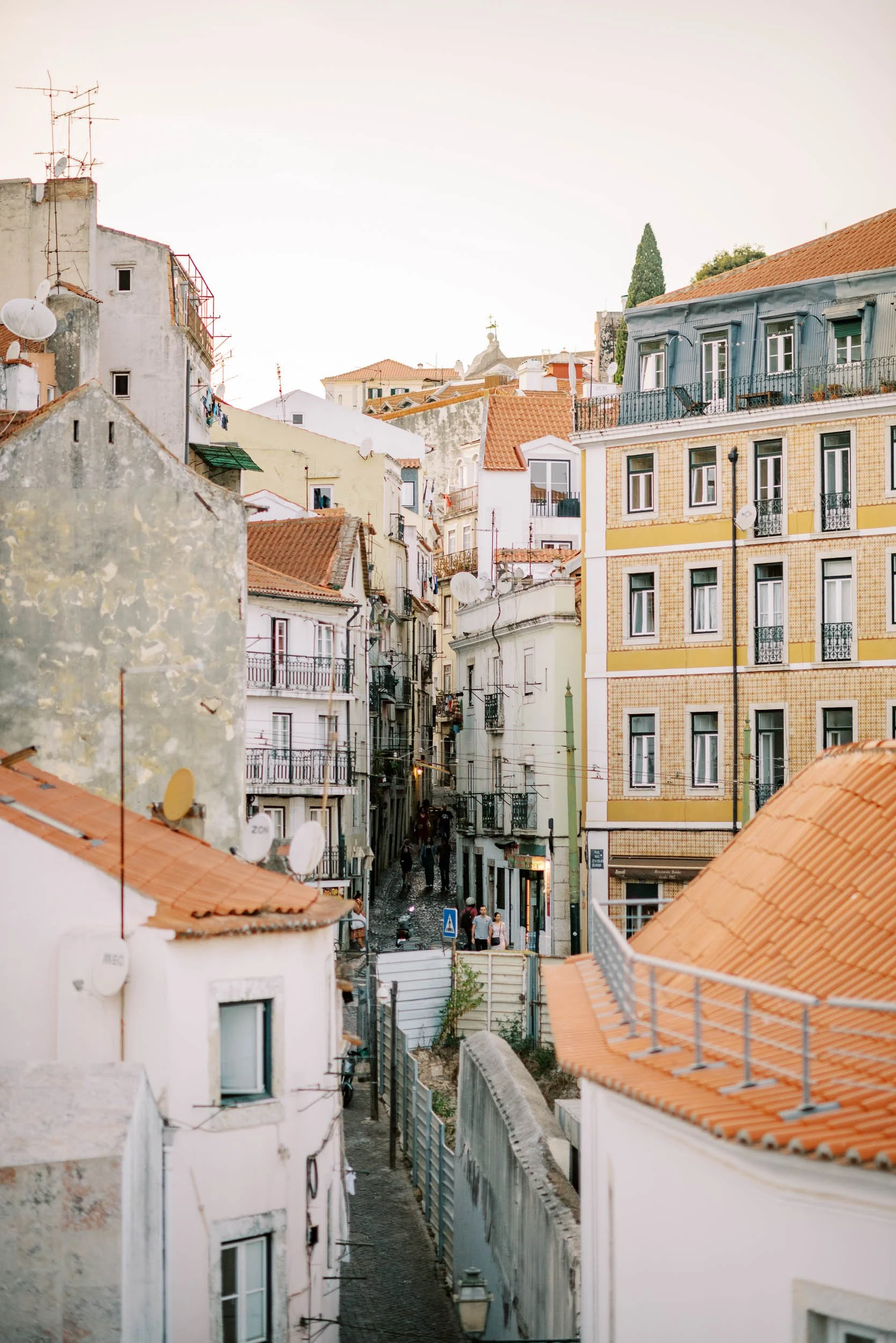 Narrow streets and old buildings in Lisbon during the welcome cocktail before a wedding at Quinta da Bella Vista in Sintra, Portugal
