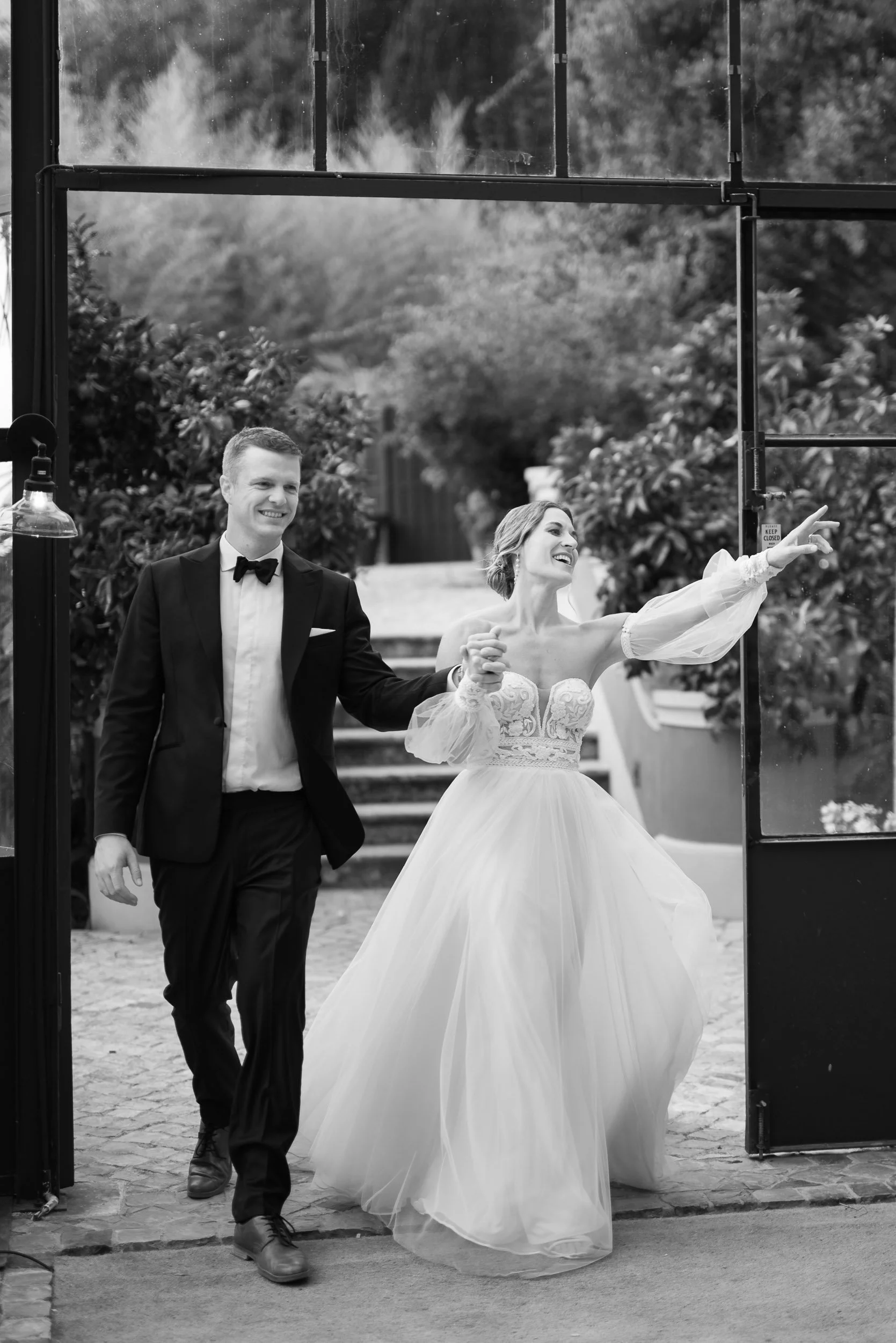 ride and groom making their entrance at the reception dinner at Quinta da Bella Vista in Sintra, Portugal