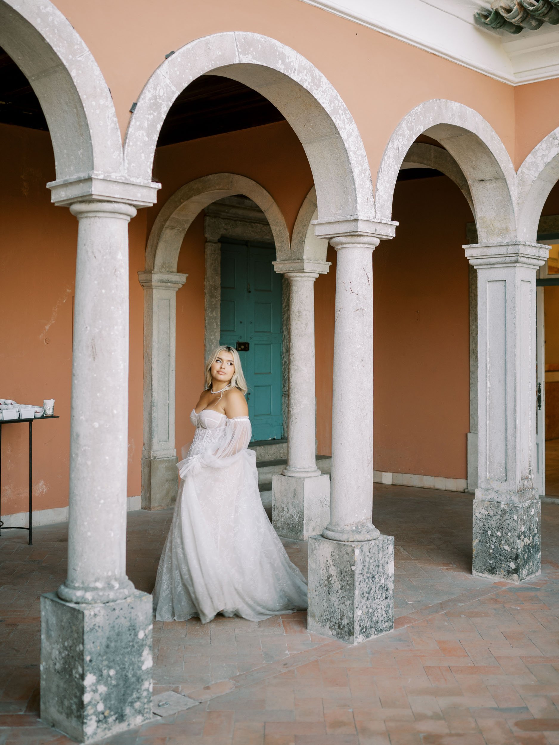 Bride portrait under the terrace arches at Casa dos Penedos in Sintra, Portugal