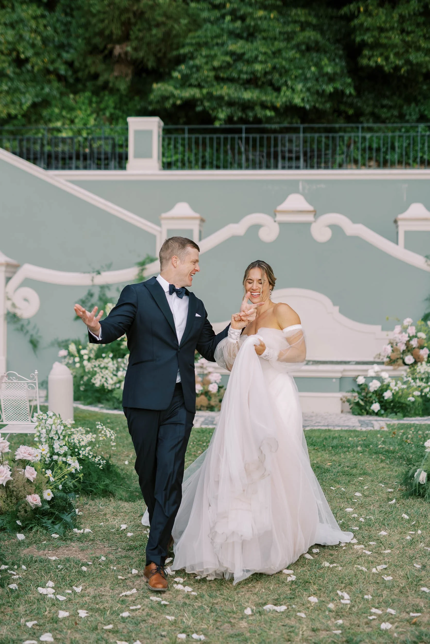 Happy bride and groom dancing after the ceremony at Quinta da Bella Vista in Sintra, Portugal
