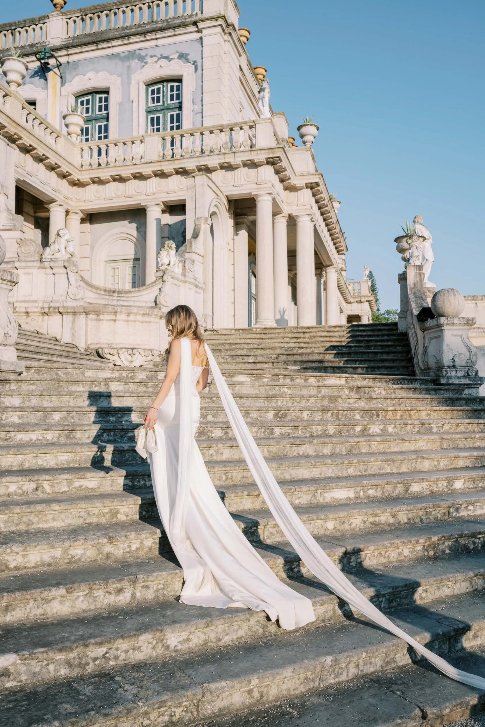 Bride portrait on the staircase at Palácio de Queluz in Portugal