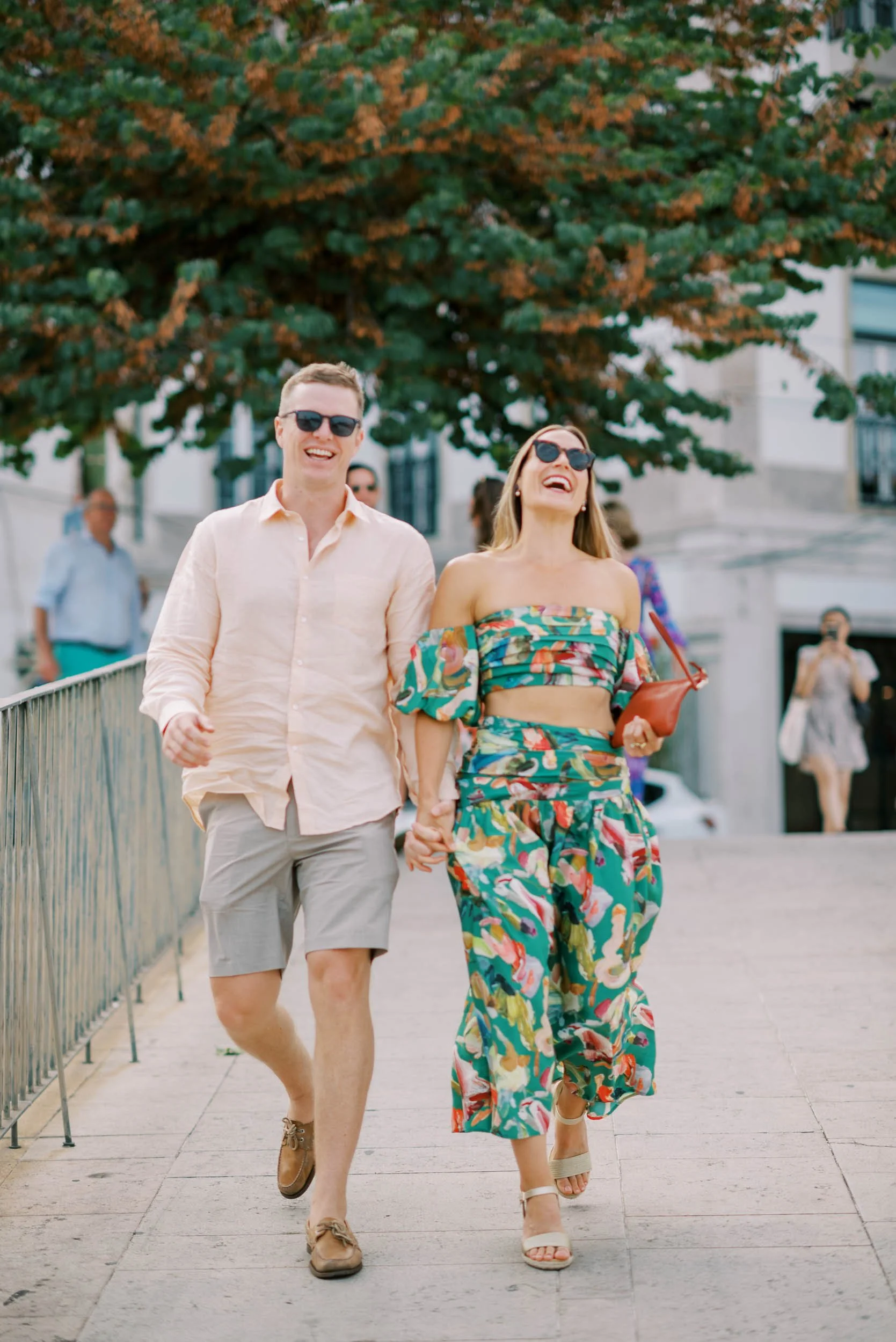 Bride and groom arriving at the welcome cocktail in Lisbon before a wedding at Quinta da Bella Vista in Sintra, Portugal