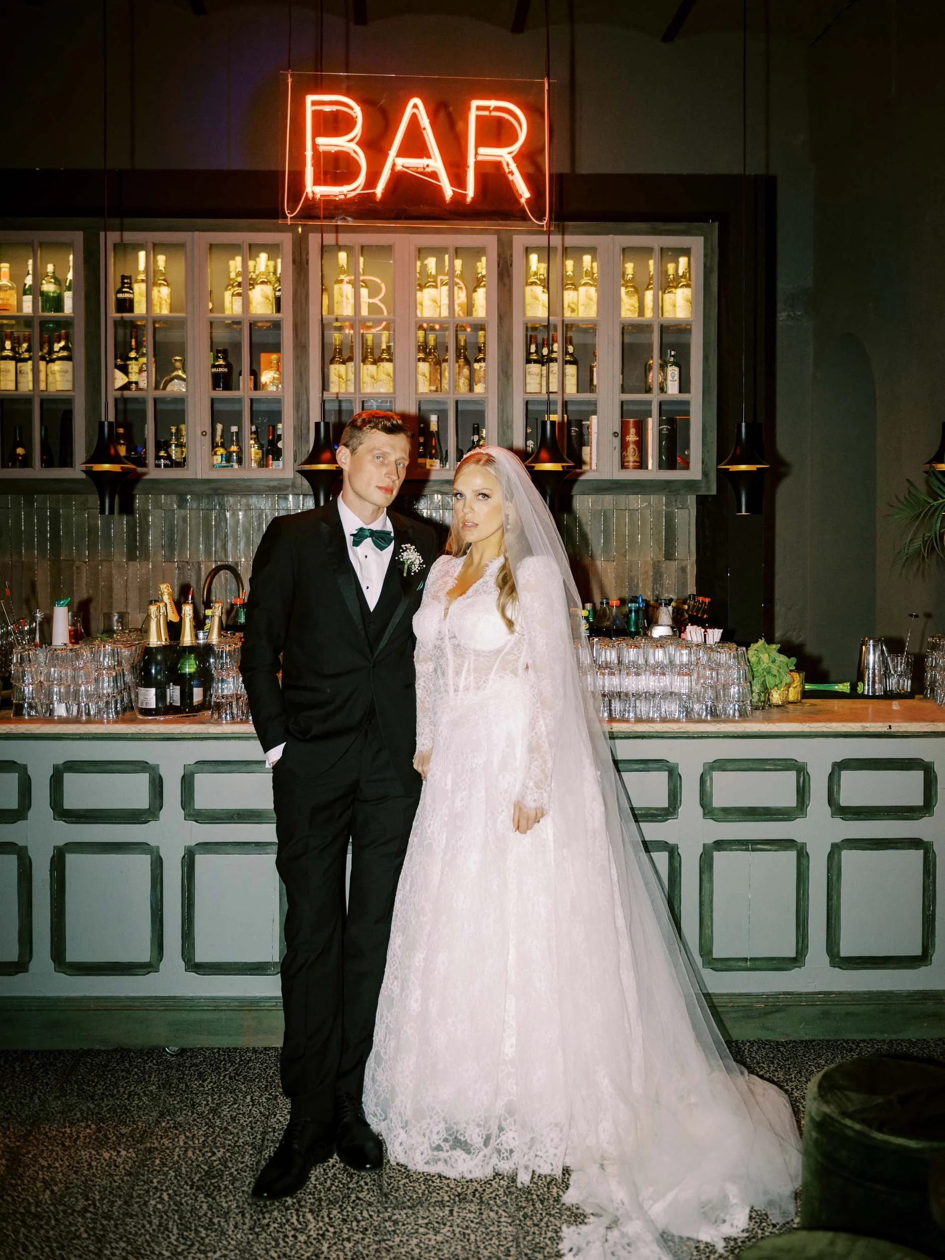 Bride and groom at the bar at La Distillerie in Lisbon, Portugal