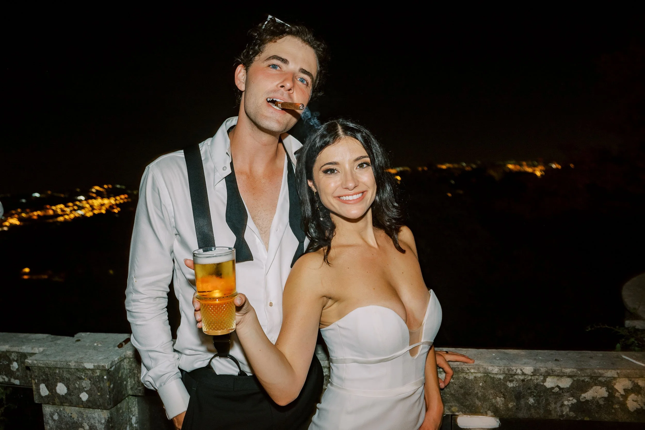 Bride and groom with drinks at Casa dos Penedos in Sintra