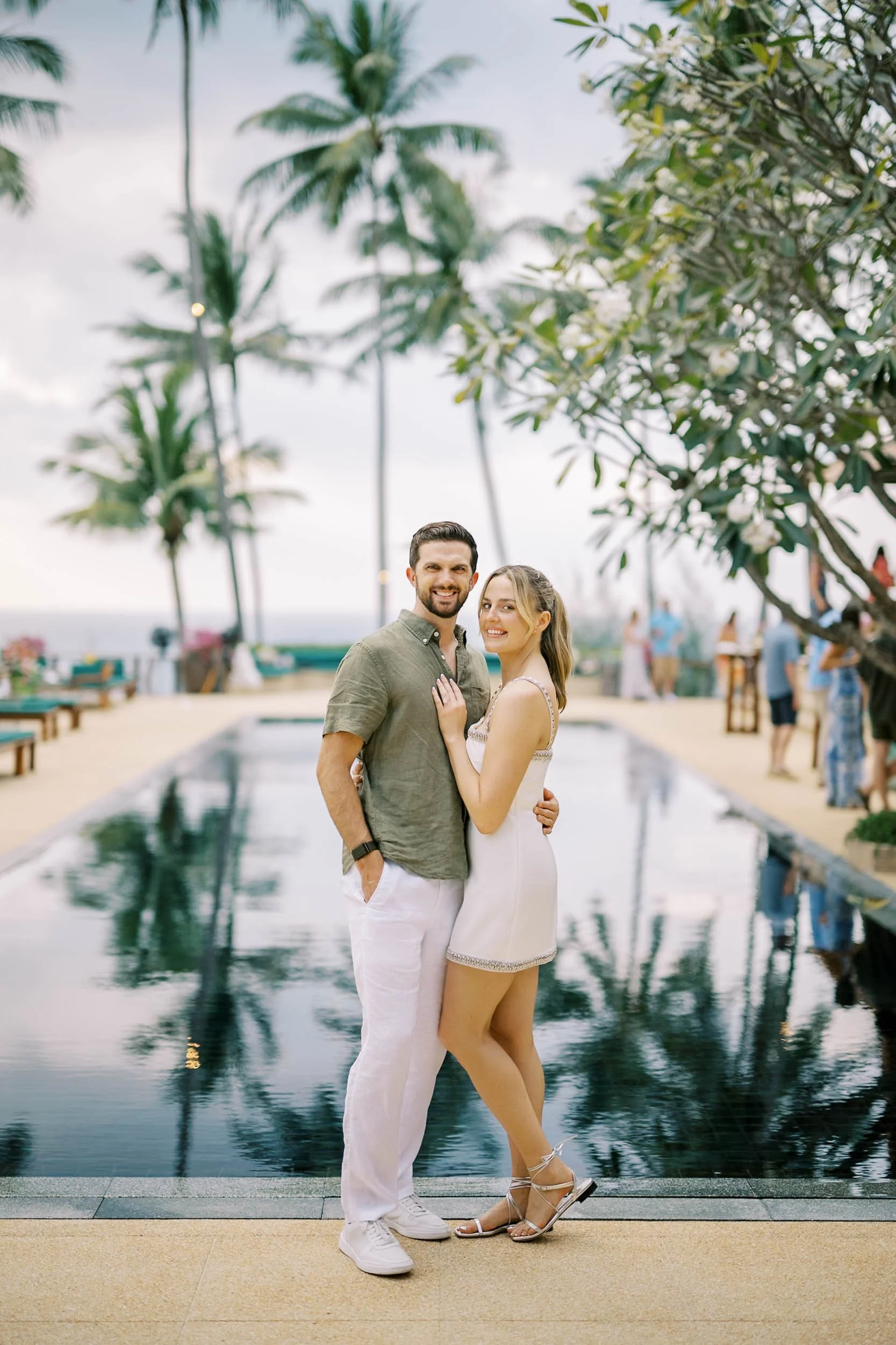 Bride and groom portrait by the pool at Amanpuri in Phuket, Thailand