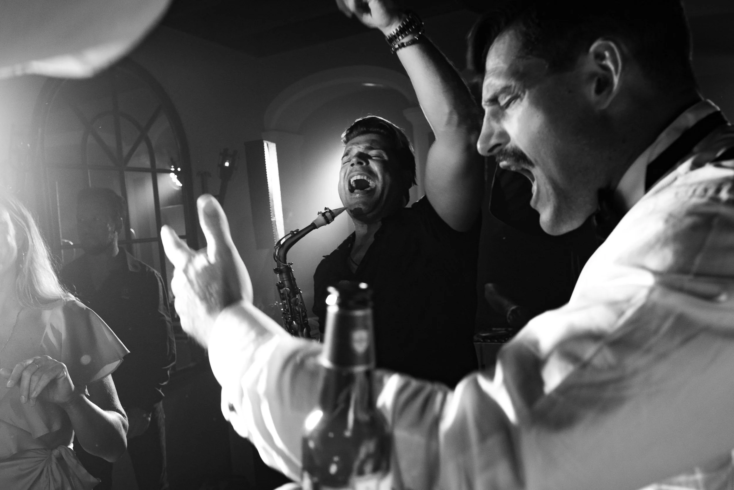 Guests dancing with live saxophone music during a wedding party at Quinta da Bella Vista in Sintra, Portugal