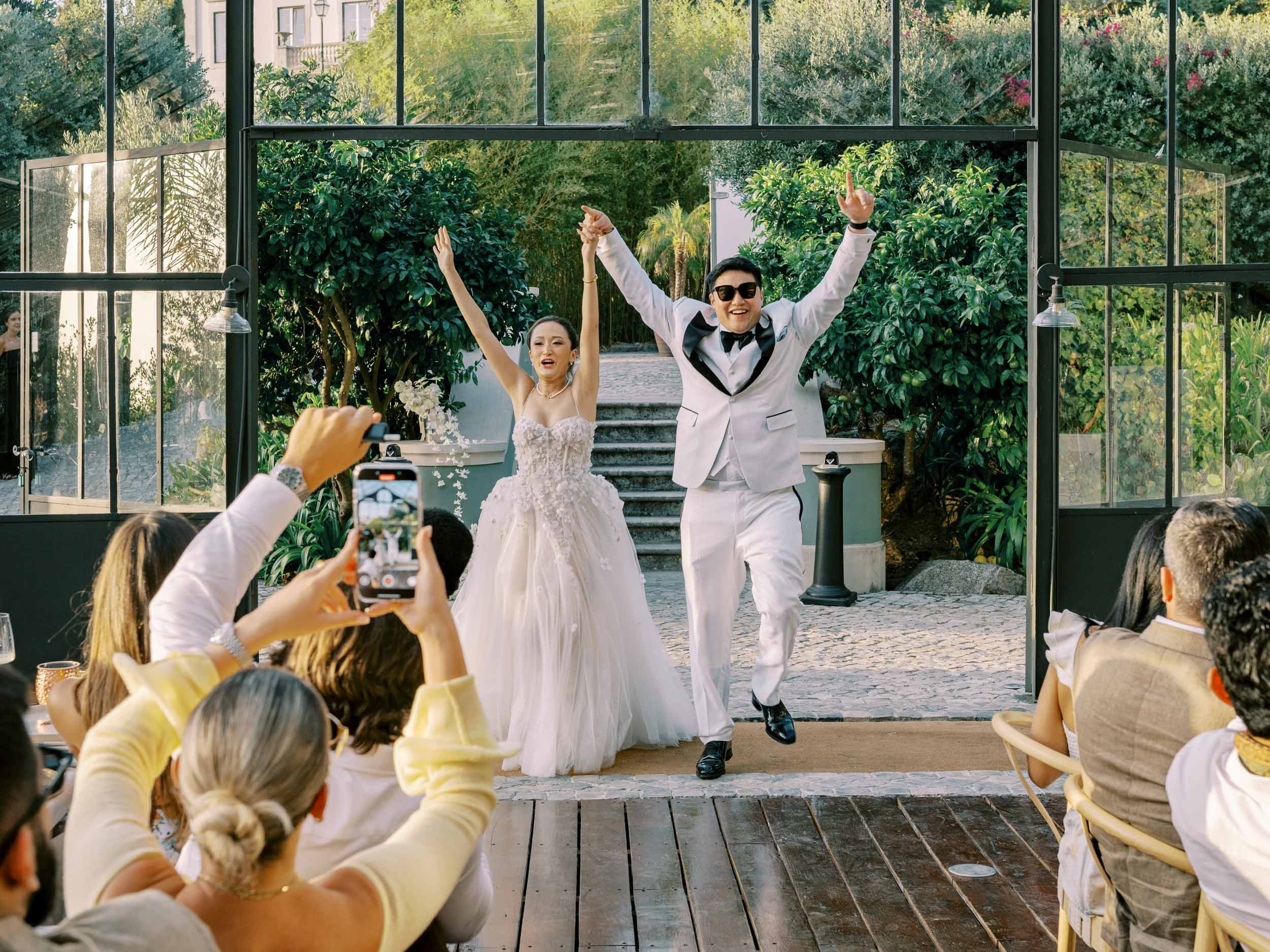 Bride and groom entering the reception dinner at Quinta da Bela Vista in Sintra, Portugal