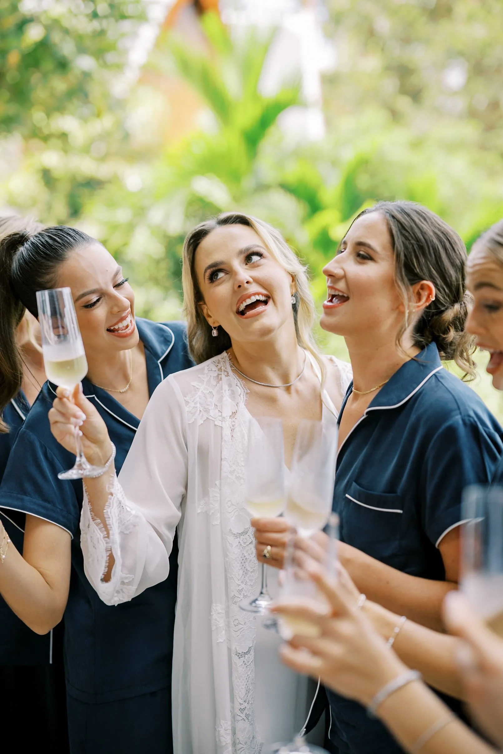 Bride celebrating with her bridesmaids before the ceremony at Amanpuri in Phuket, Thailand