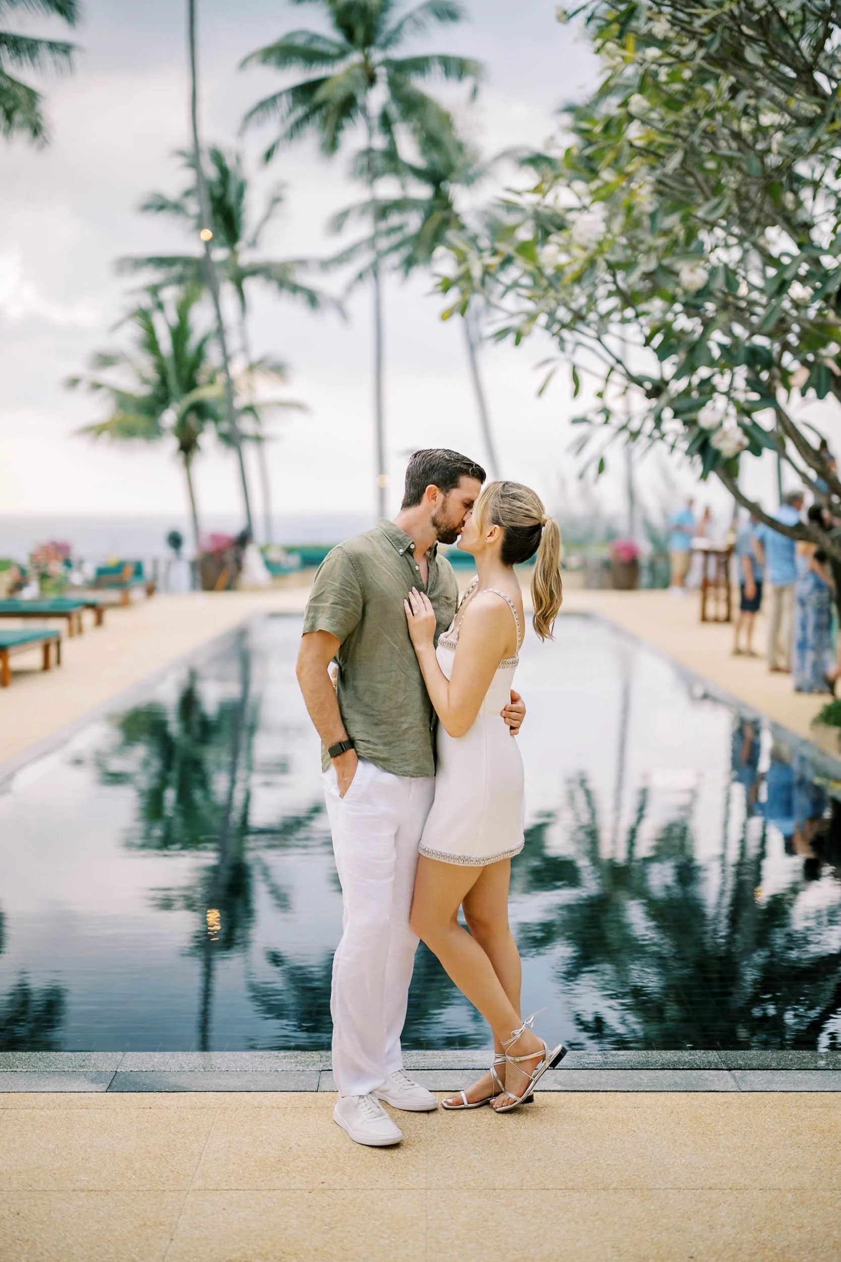 Bride and groom portrait by the pool at Amanpuri in Phuket, Thailand
