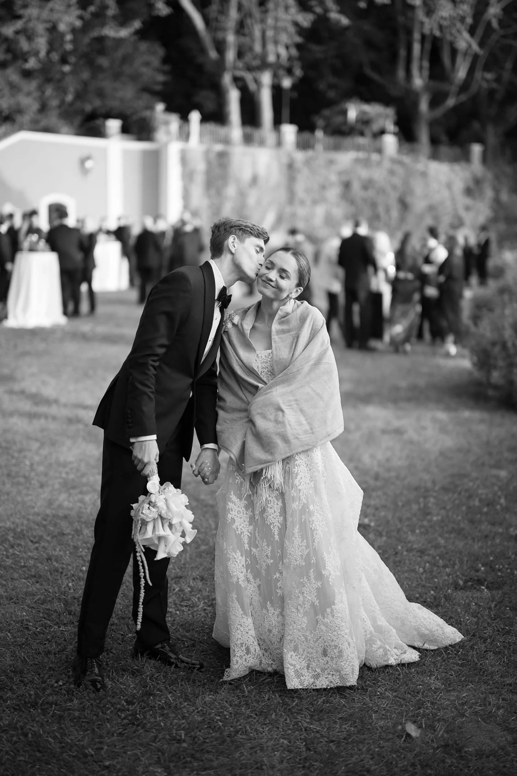 Bride and groom sharing a quiet outdoor moment during the wedding celebration