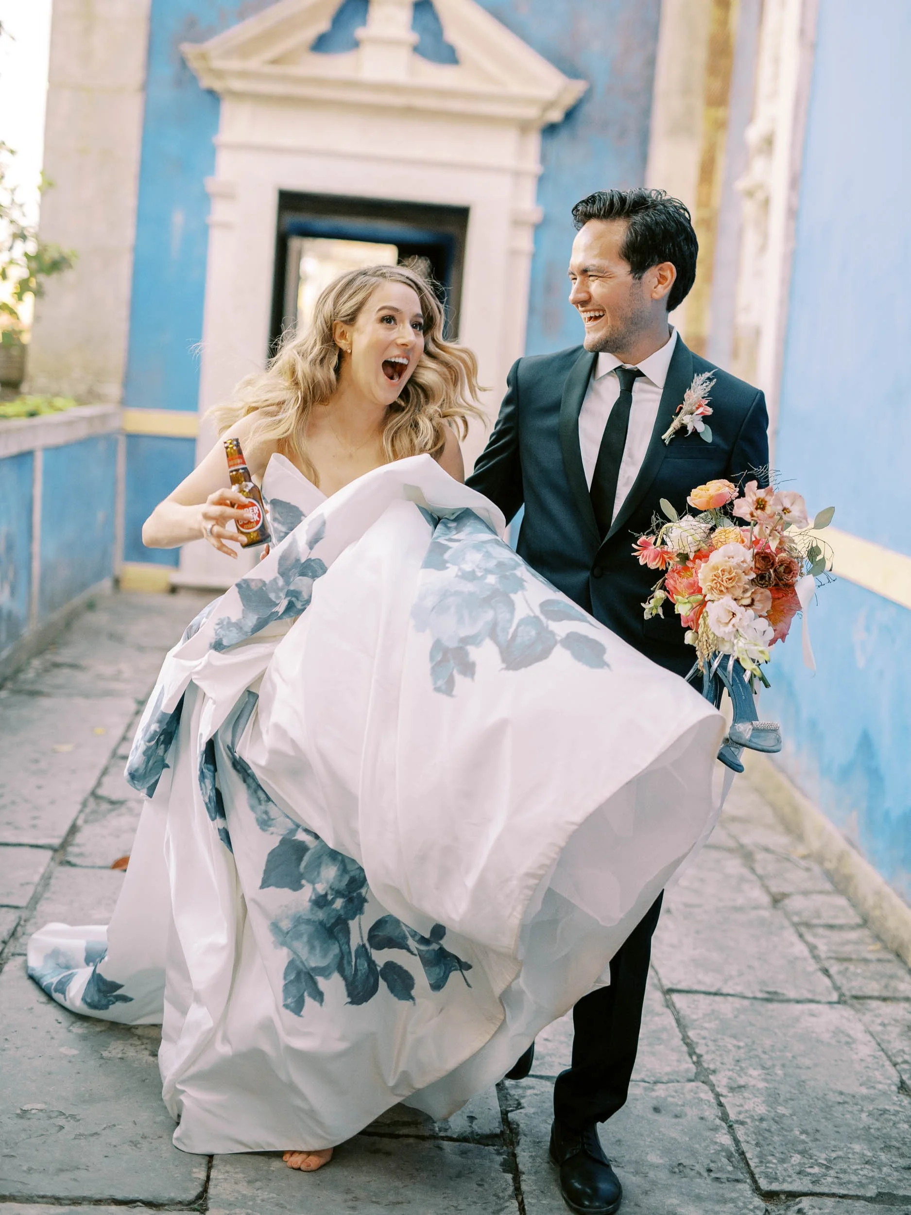 Bride and groom laughing together at Palácio dos Marqueses de Fronteira in Lisbon, Portugal
