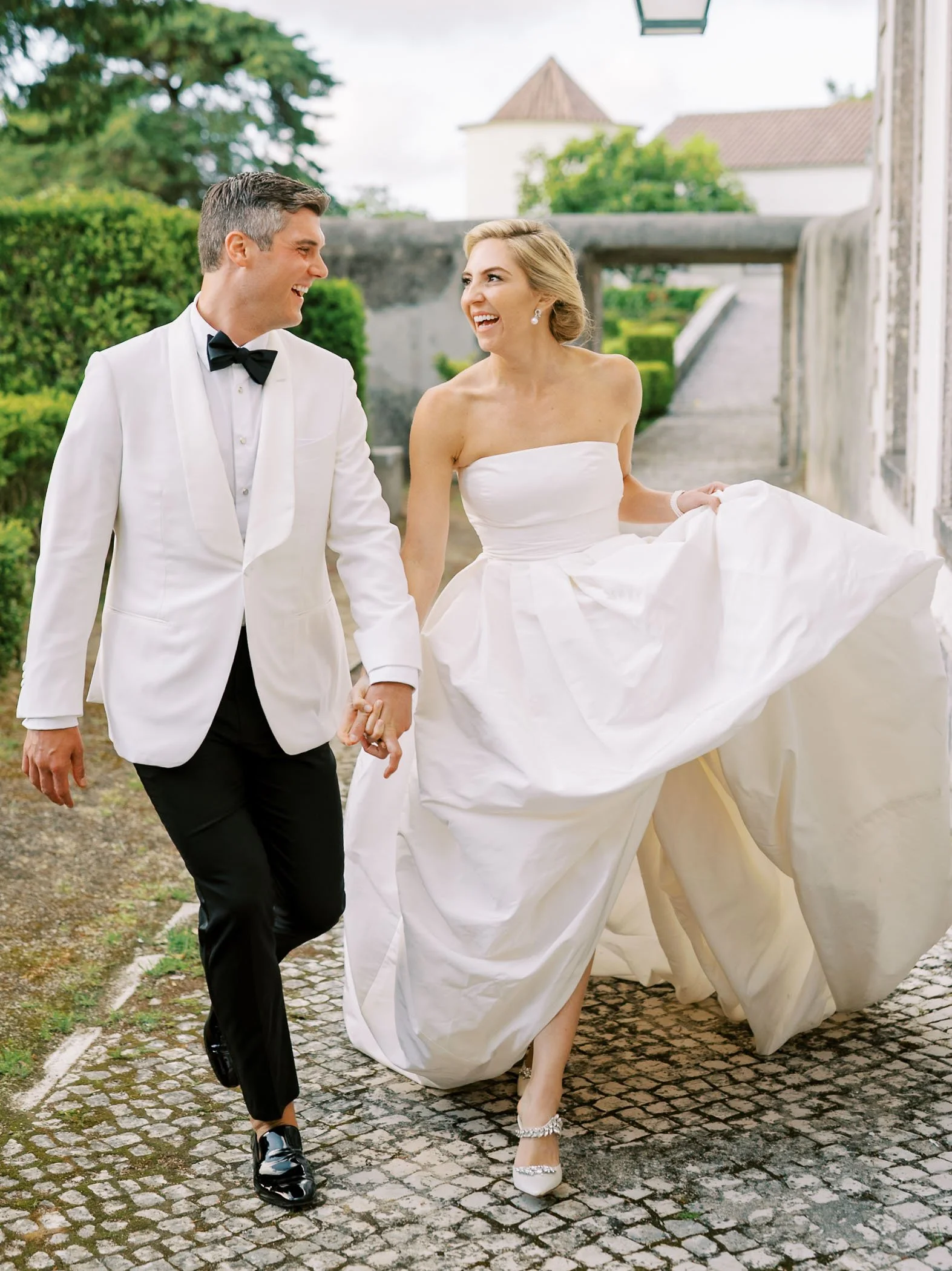 Bride and groom walking at Palácio de Seteais in Sintra, Portugal