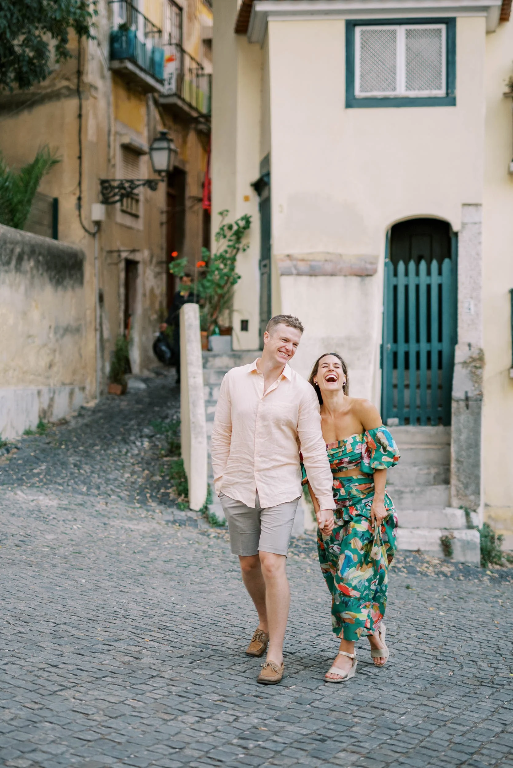 Couple walking in old Lisbon ahead of a wedding at Quinta da Bella Vista in Sintra, Portugal