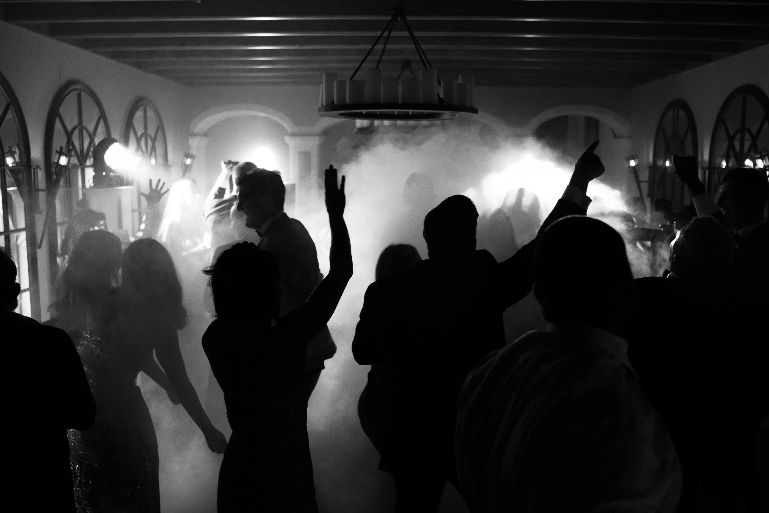Guests dancing in the wine cellar during a wedding at Quinta da Bella Vista in Sintra, Portugal